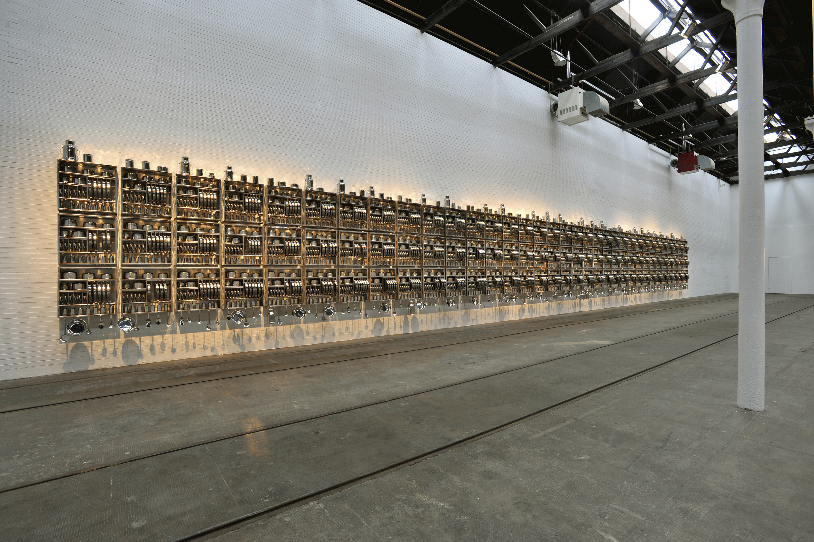 Subodh Gupta’s “Take off your shoes and wash your hands.”