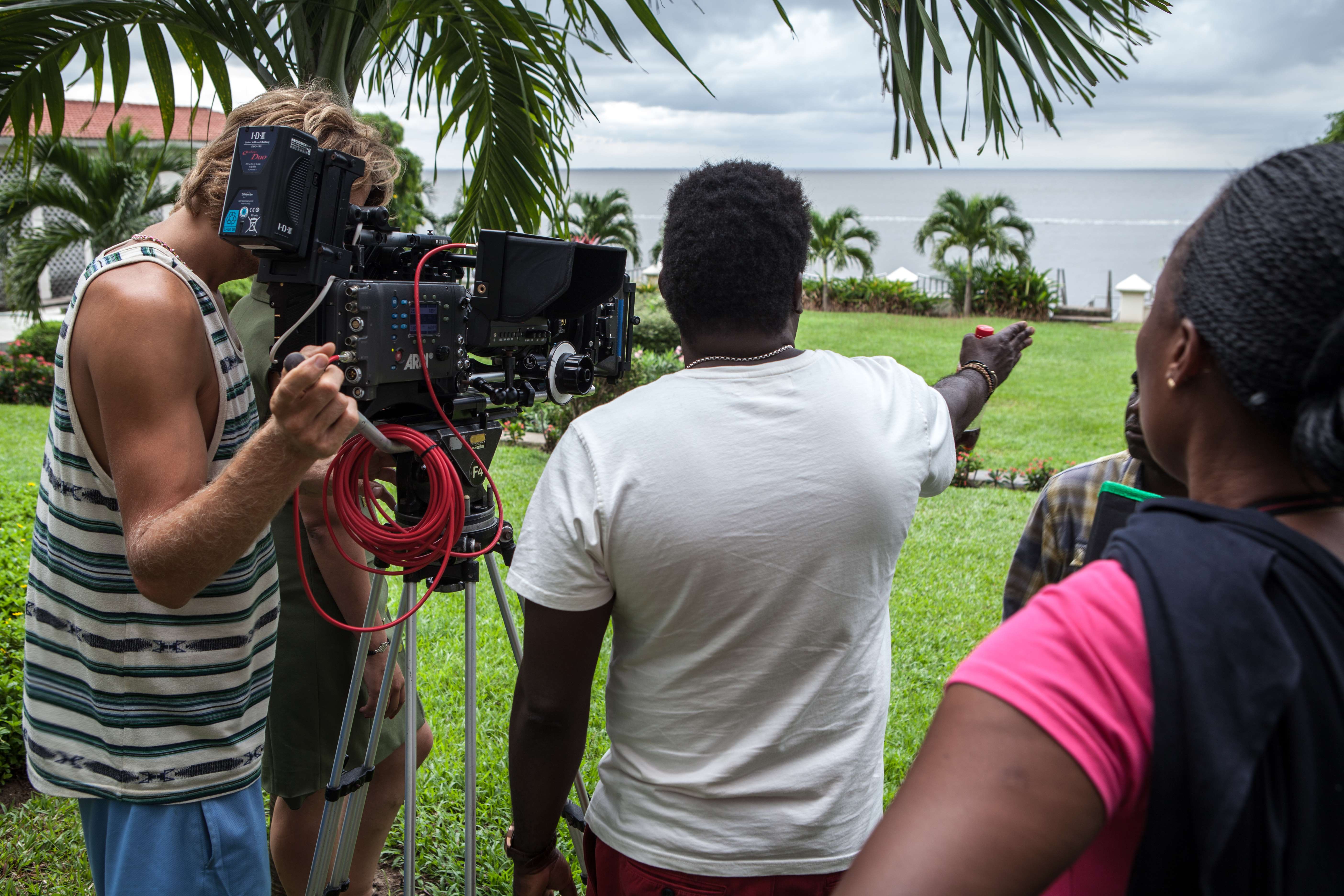 NIGERIA: Nollywood director Kunle Afolyan (center) spoke with technicians on a film set in Lagos, Nigeria, on Sept. 14.