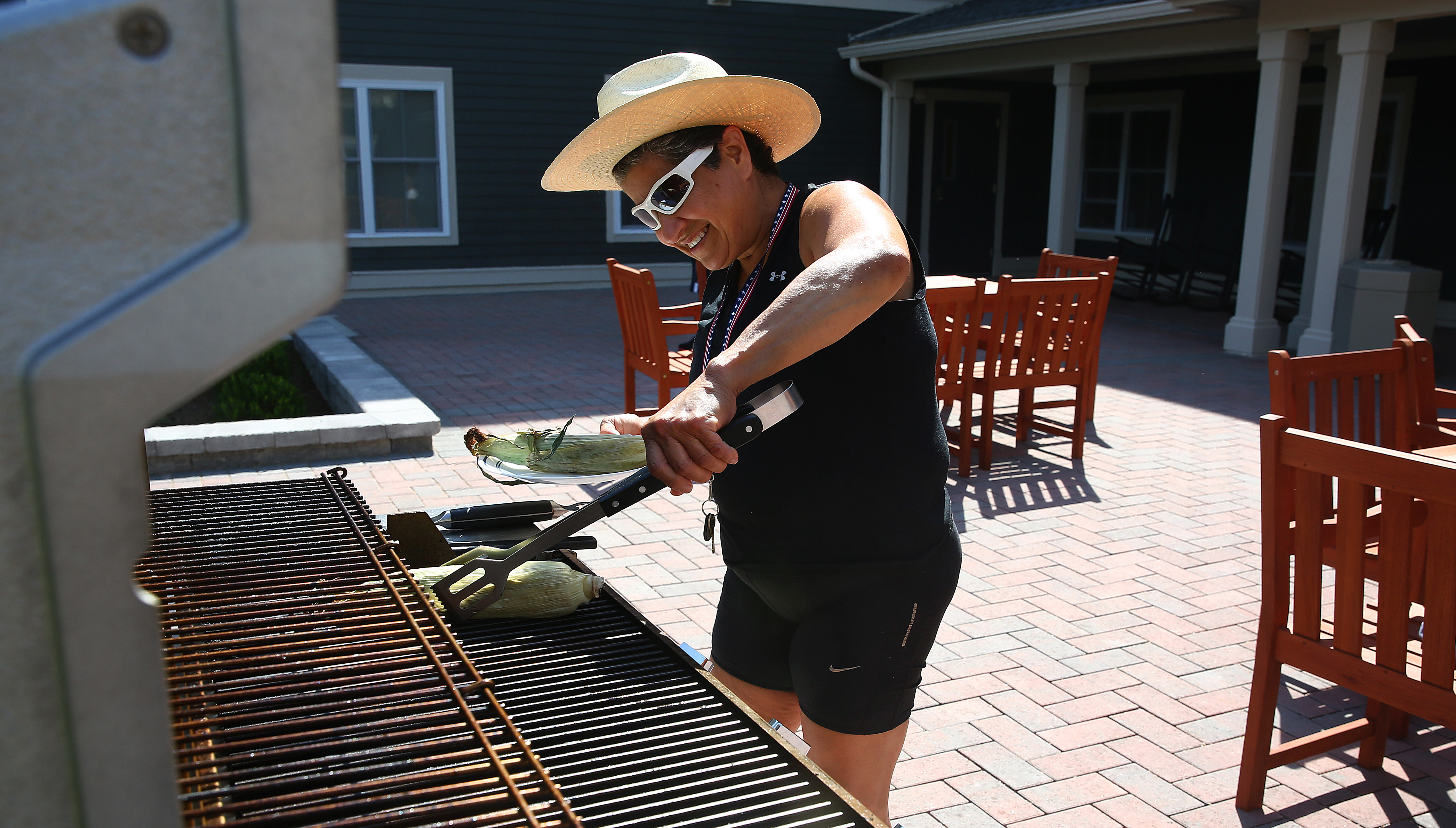 Elva Alvarado grills herself some corn at Bedford Green.