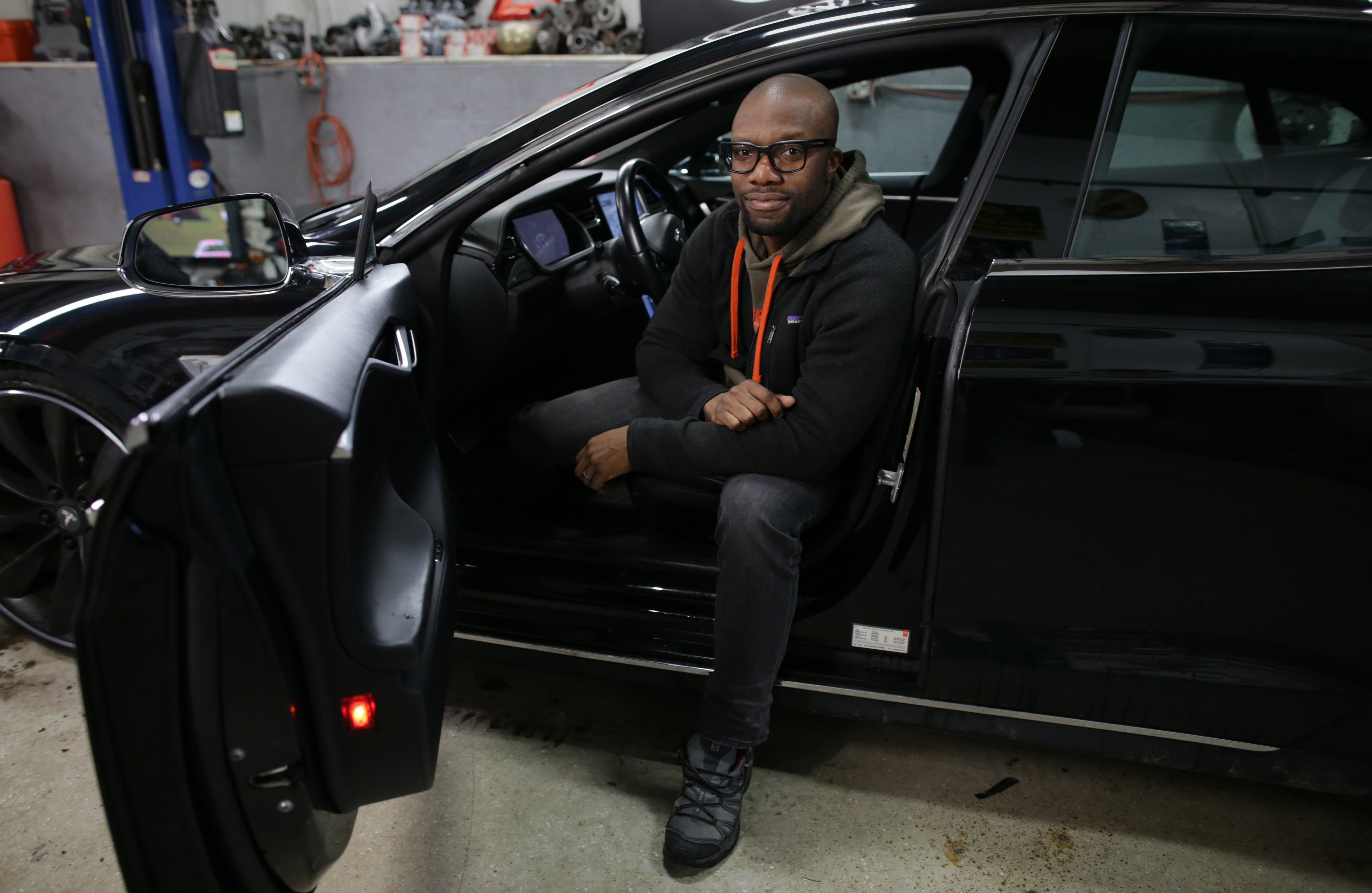 Rich Benoit inside one of the Teslas that he has refurbished.
