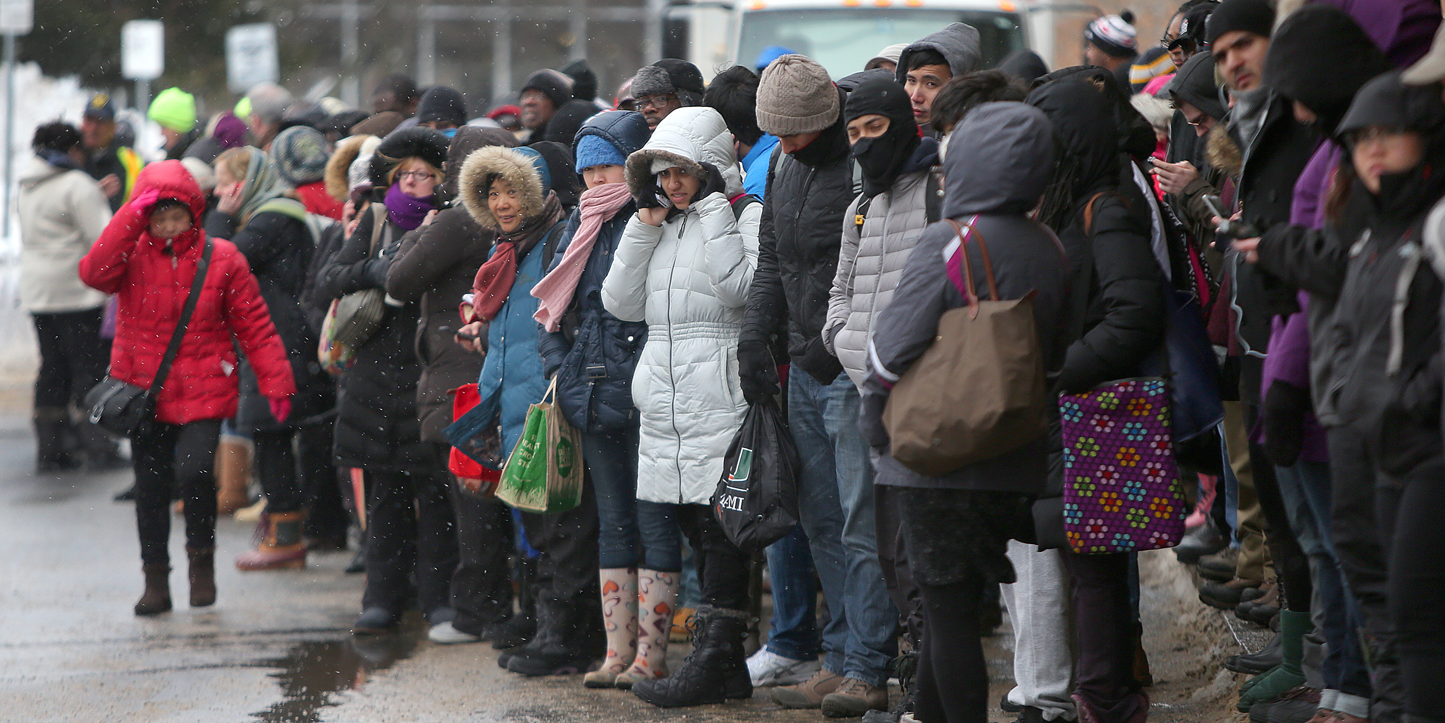 Passengers at the Quincy Center stop on the Red Line often waited hours for shuttle buses, after trains on the Braintree branch went out of service for weeks.