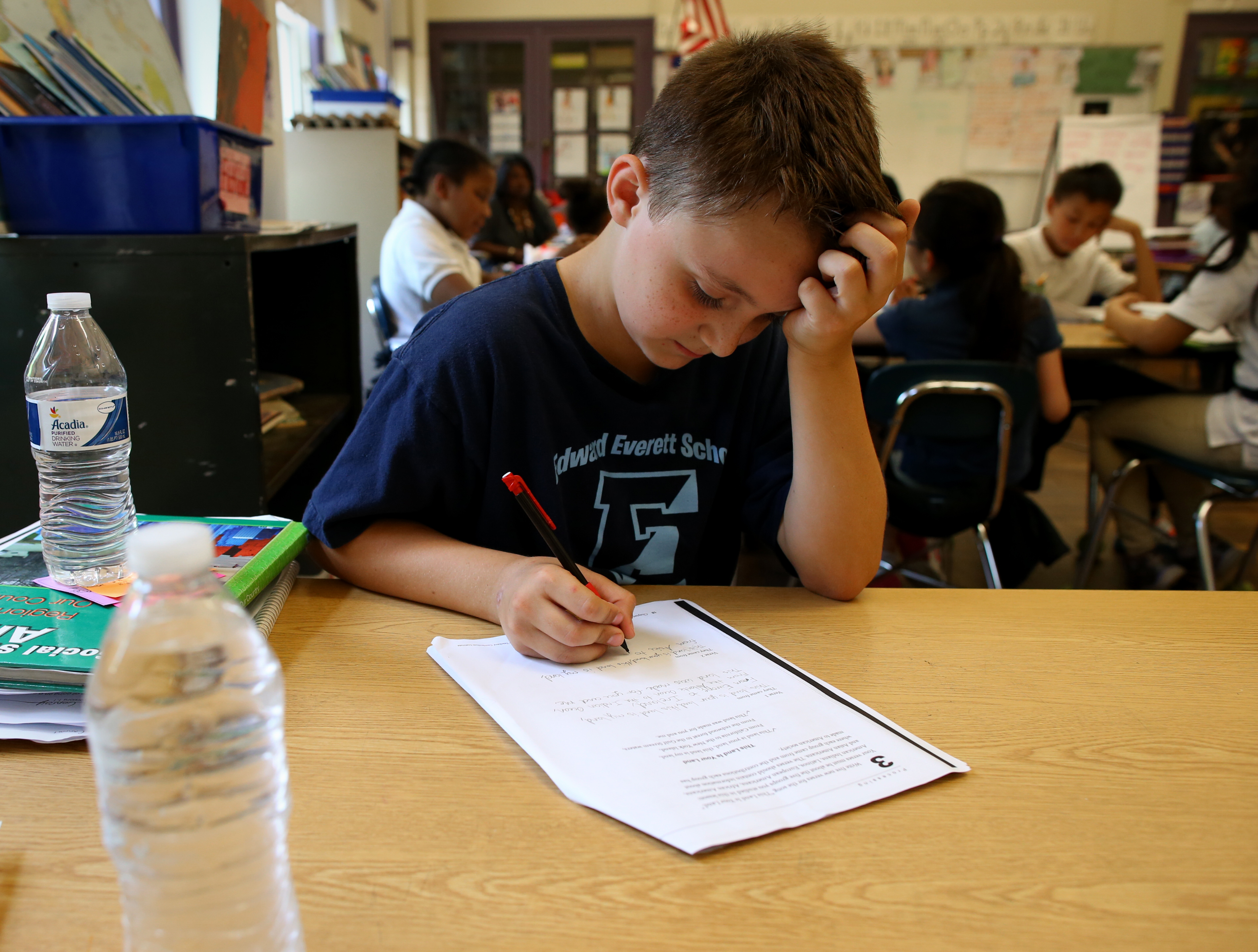 Dylan Conroy, a fourth-grade pupil at Edward Everett Elementary School, kept bottled water on his desk.