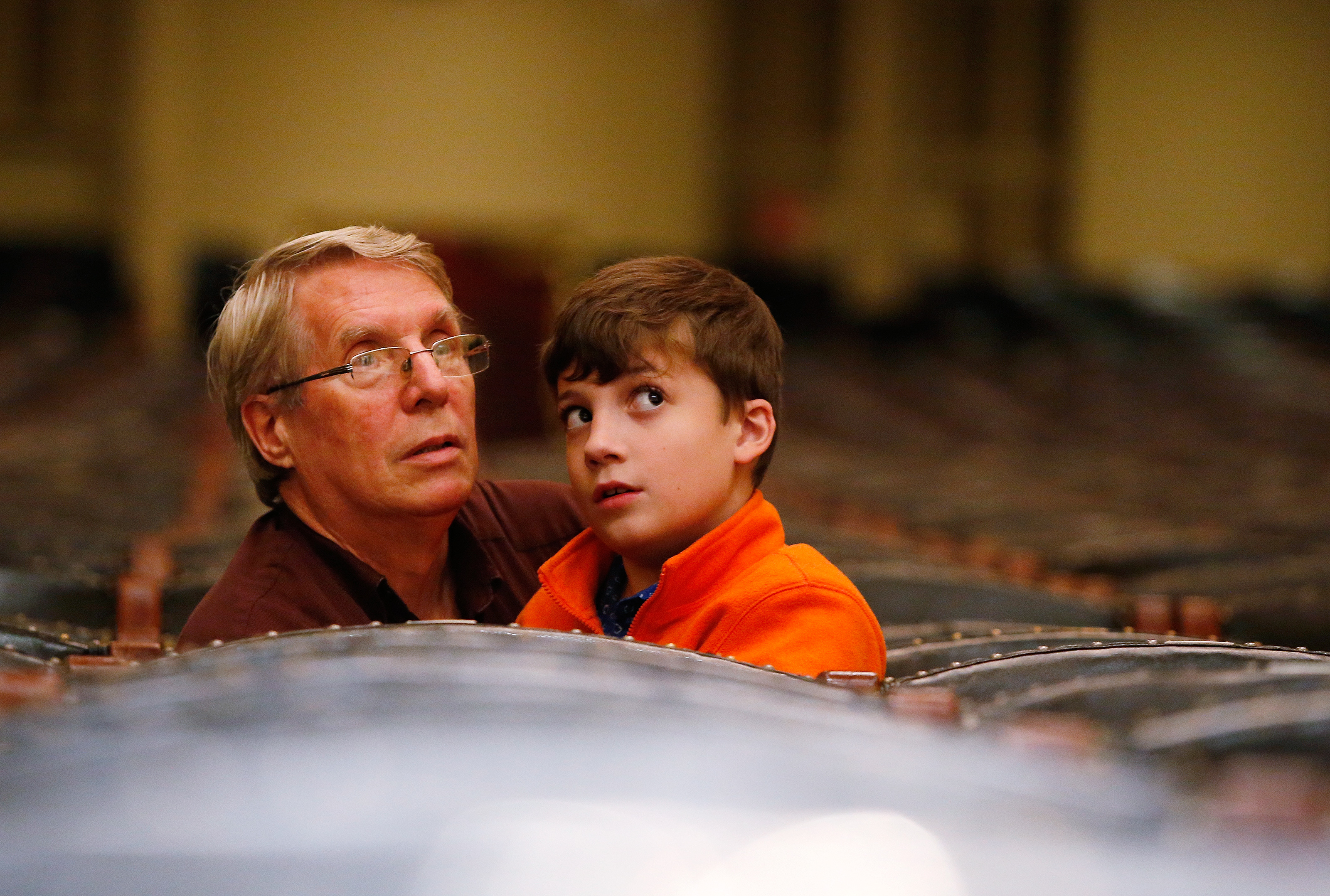 Ronan Mattin (right) is “obsessed with instruments,” said his grandfather, Stephen Mattin (left). “He sees an instrument and he dives for it.”