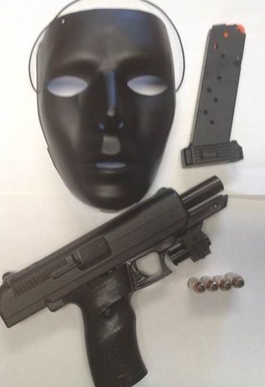 The mask and gun allegedly seized during the traffic stop