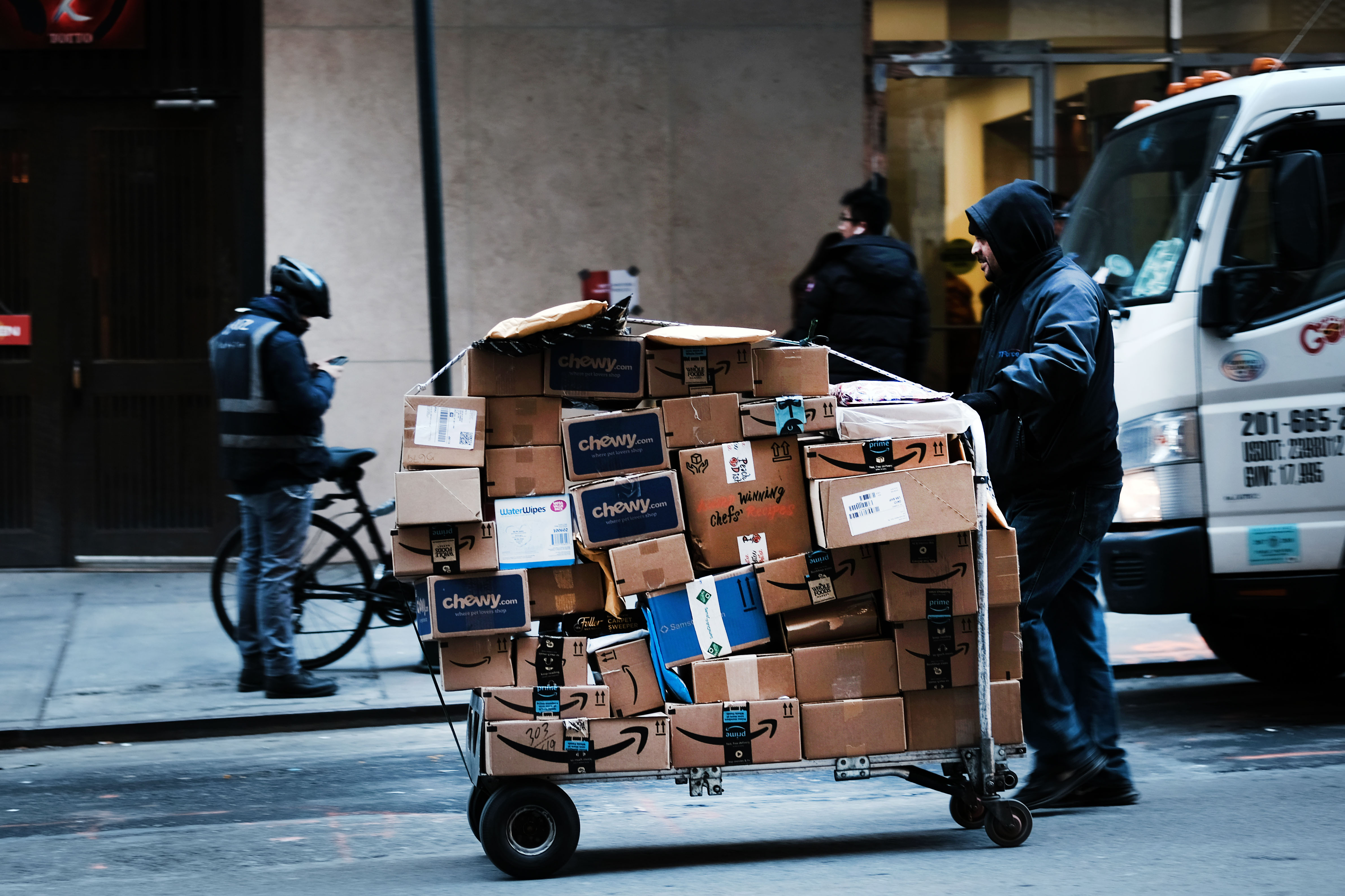 The cardboard boxes Amazon uses, as well as its padded pouches, are in theory 100 percent recyclable. But recycling is no panacea.