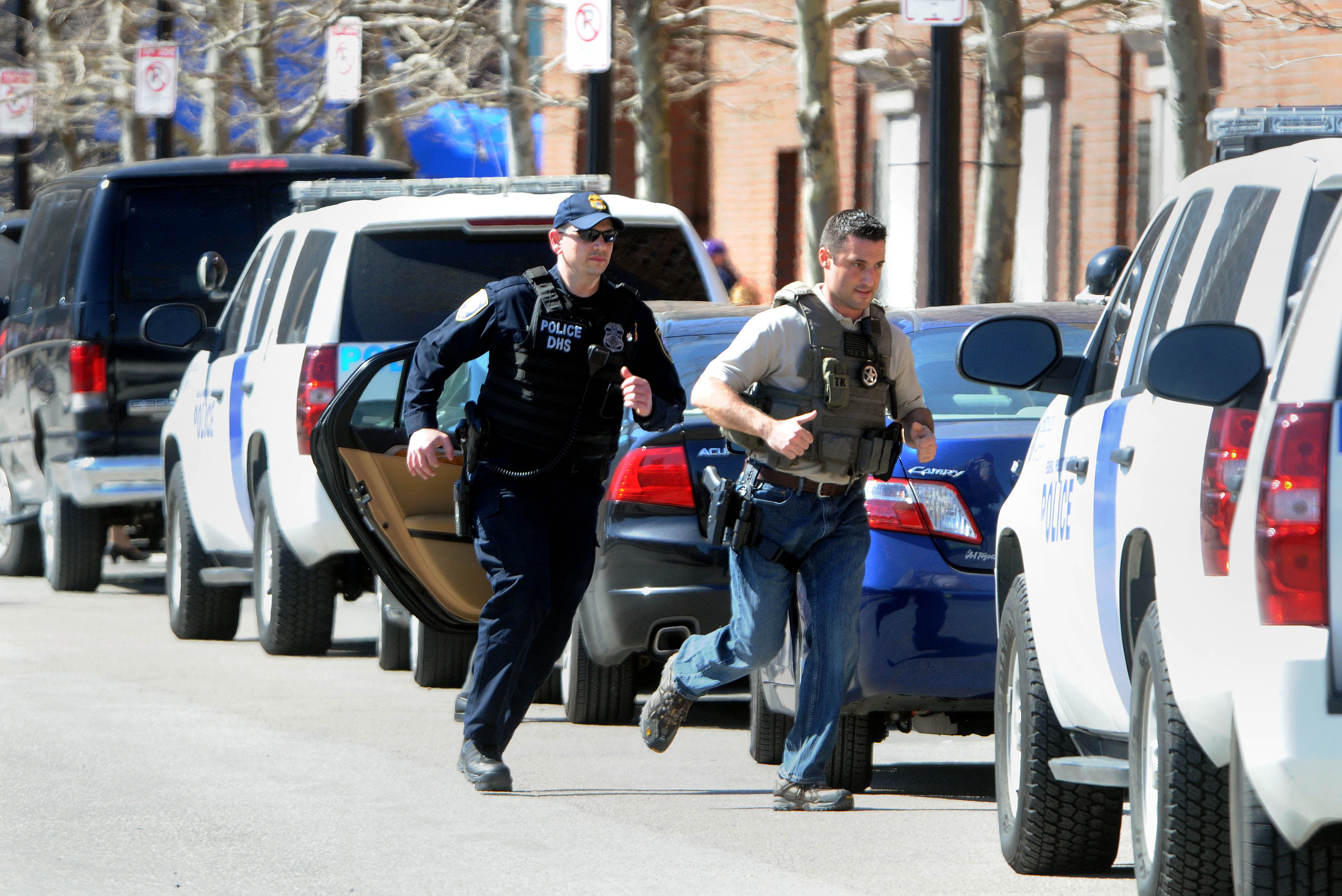 Federal officials sprinted to the federal Moakley courthouse after an evacuation order was issued. After a search, the courthouse was reopened.
