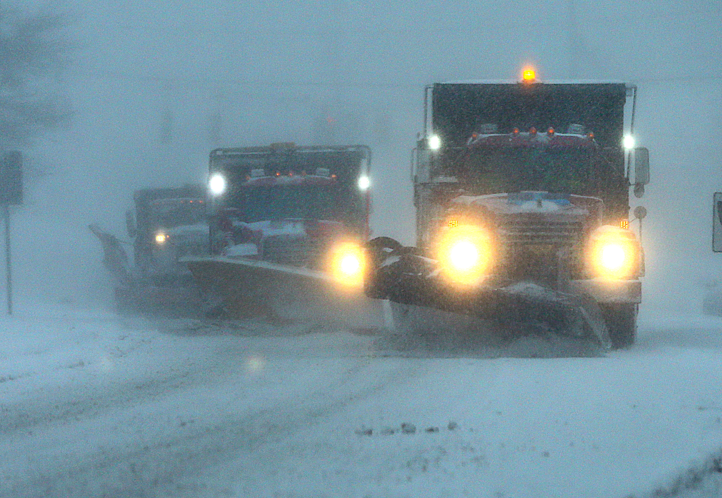Plows along Route 53 in Hanover during whiteout conditions in the late afternoon.