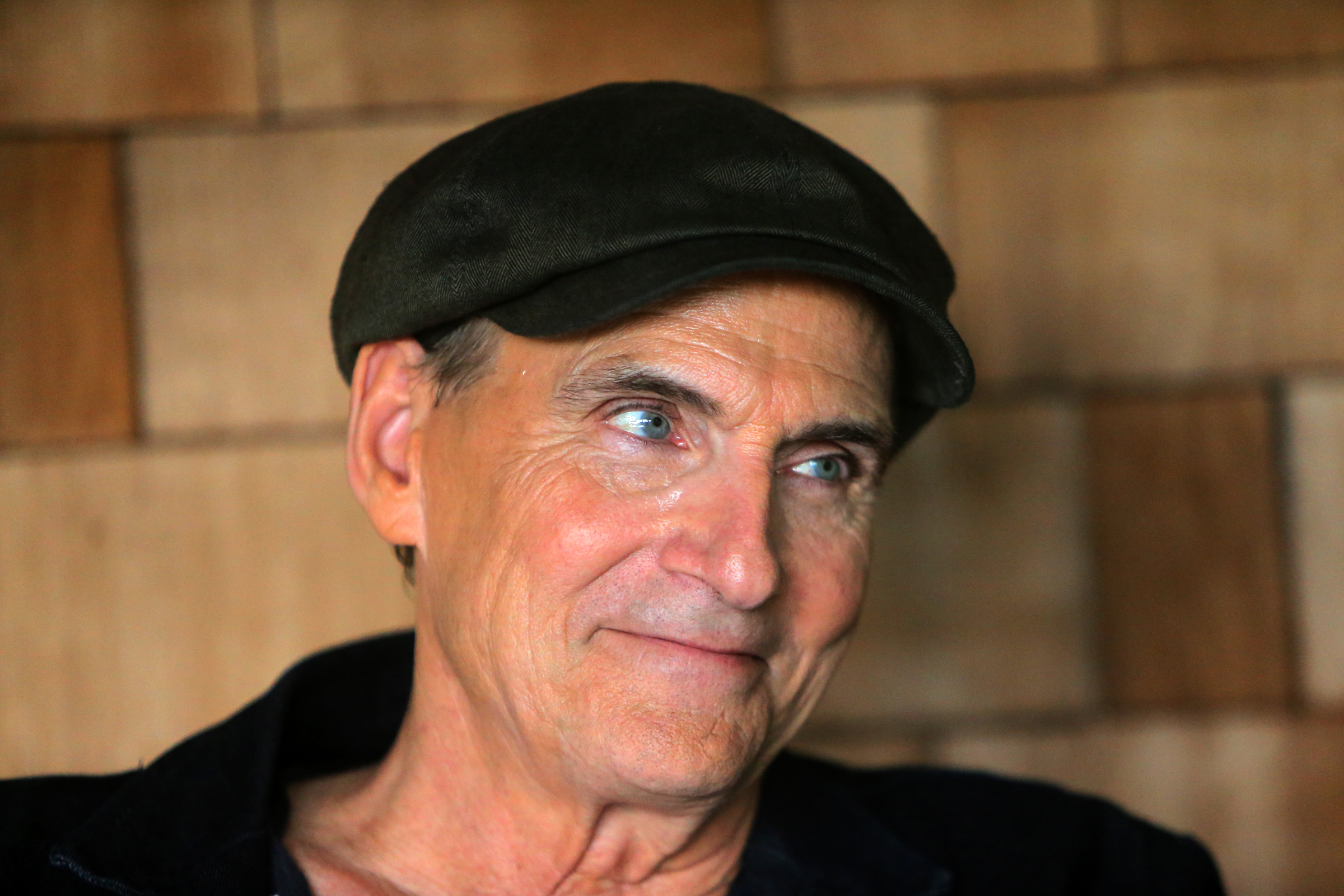 “I’m re-encouraged that I can still do this and it still works,” said James Taylor, pictured sitting on the porch of his Lenox home.