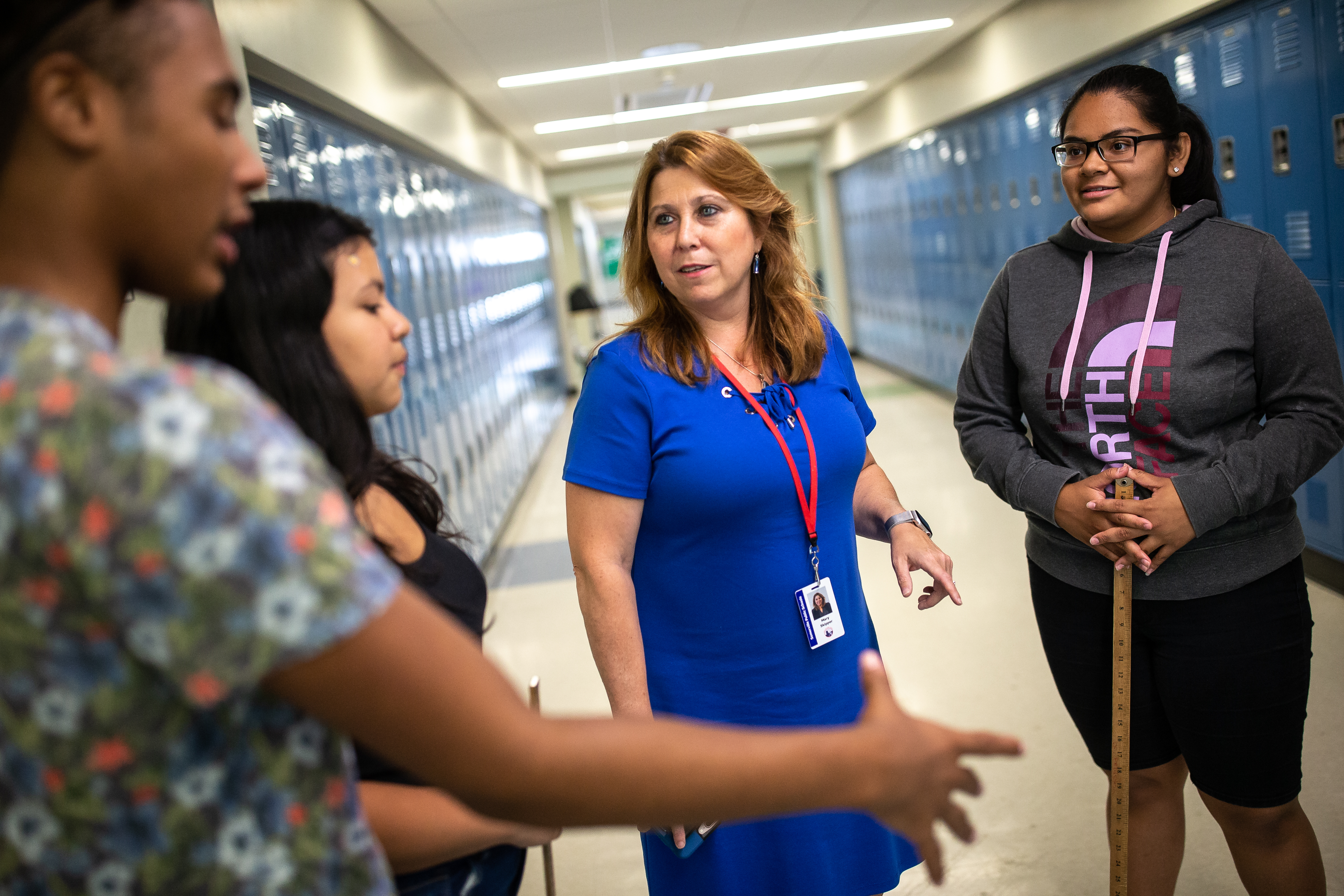 Somerville Superintendent Mary Skipper (second from right) speaks with students at East Somerville Community School.