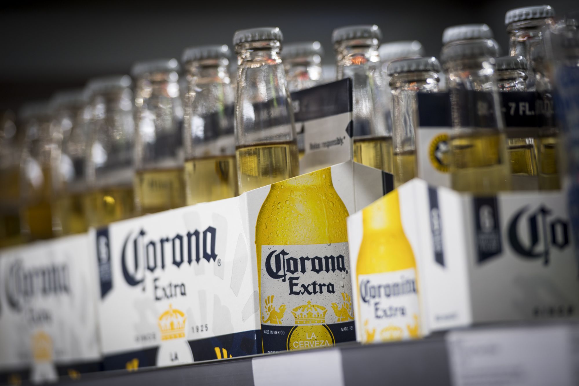 Bottles of Constellation Brands Inc. Corona beer sit on display for sale inside a BevMo Holdings LLC store in Walnut Creek, California, U.S., on Wednesday, Jan. 3, 2018. Constellation Brands Inc. is scheduled to release earnings figures on January 5.