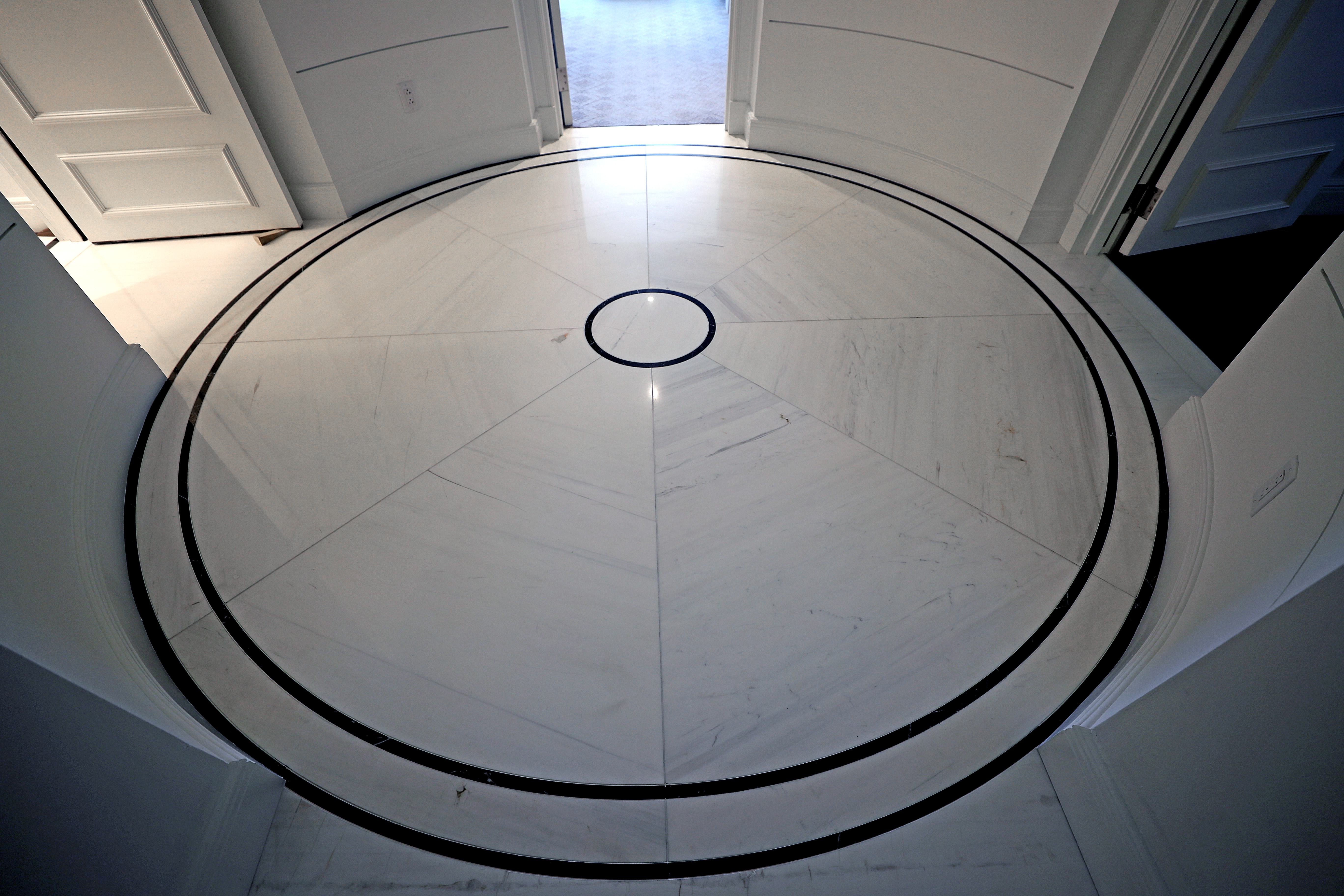 The marbled flooring in the foyer.
