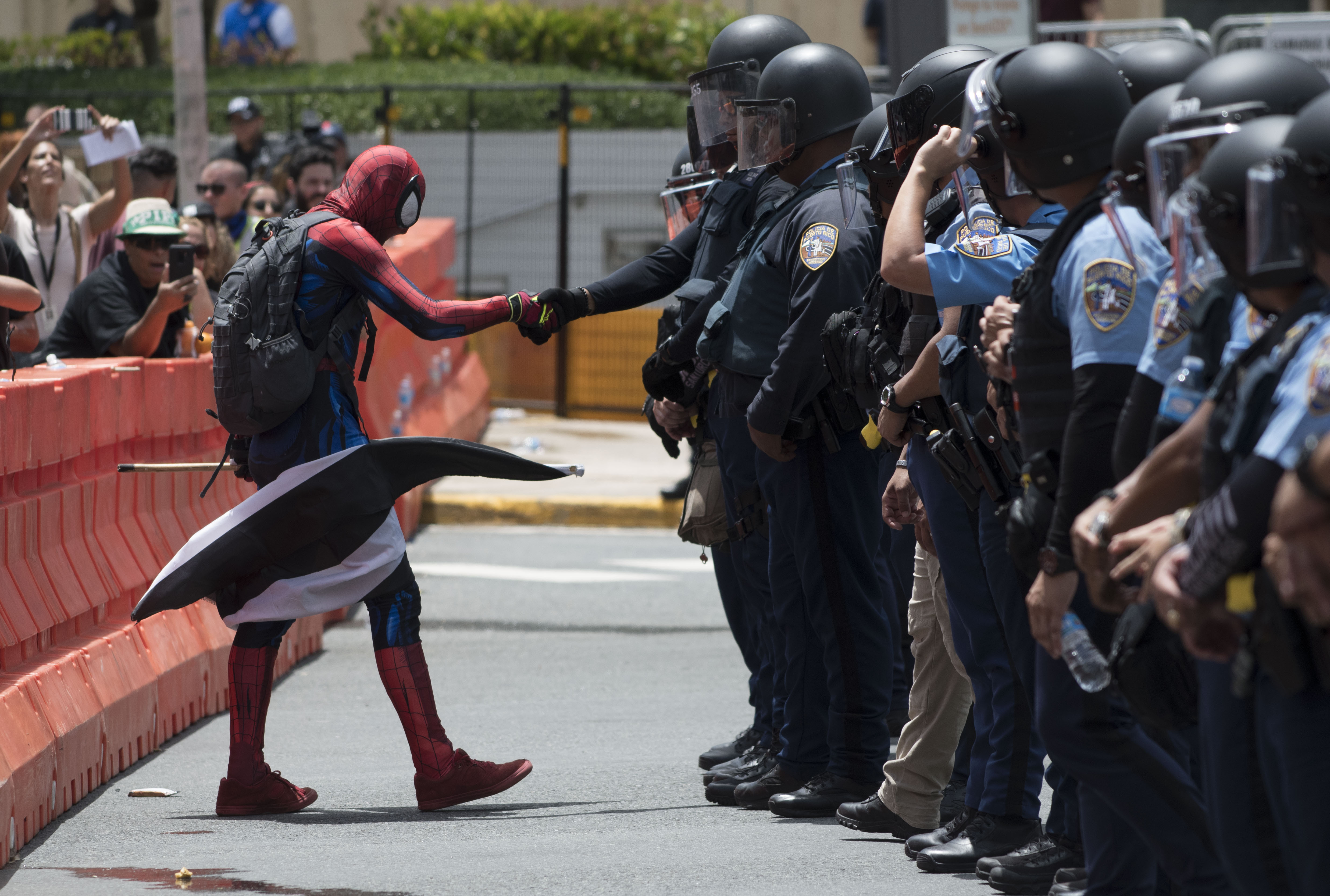 A protester dressed as Spiderman exercised civil disobedience when crossing the perimeter established by the police during a protest against the Federal Fiscal Control Board in San Juan, Puerto Rico.