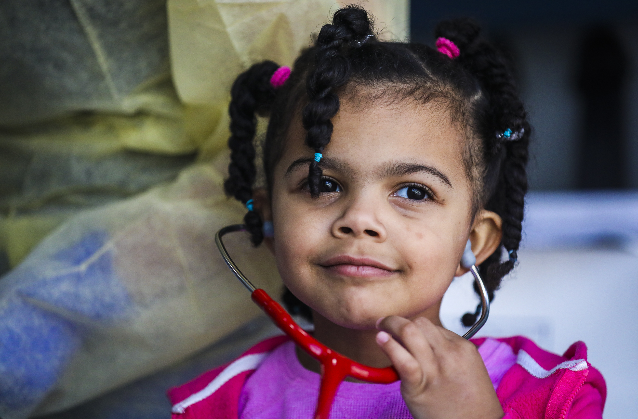 Truth Rucker, 4-years-old, wore Dr. Rachel Sagor's stethoscope after her siblings had a health checkup.