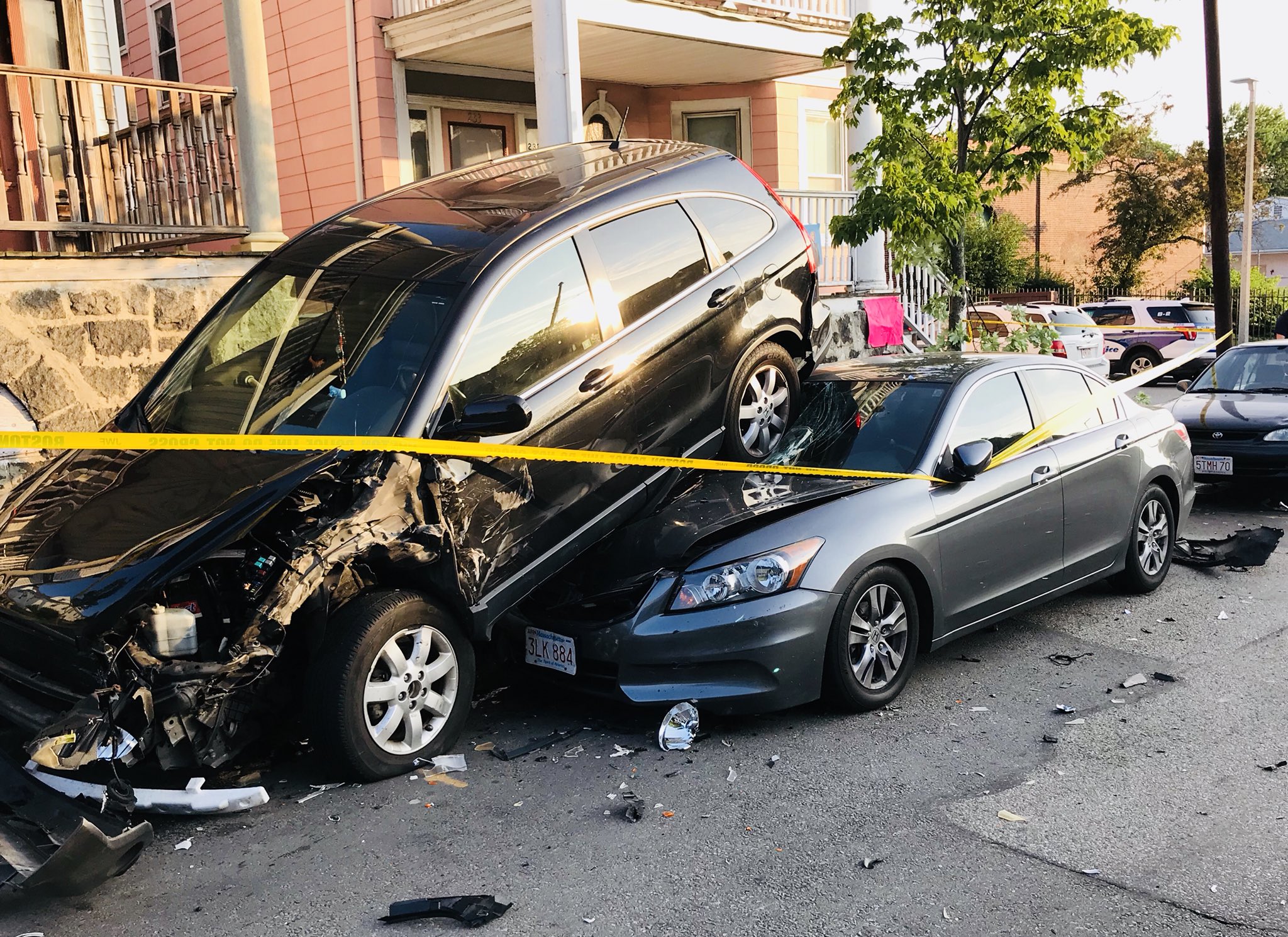 SUV ends up on top of car in Roxbury crash The Boston Globe