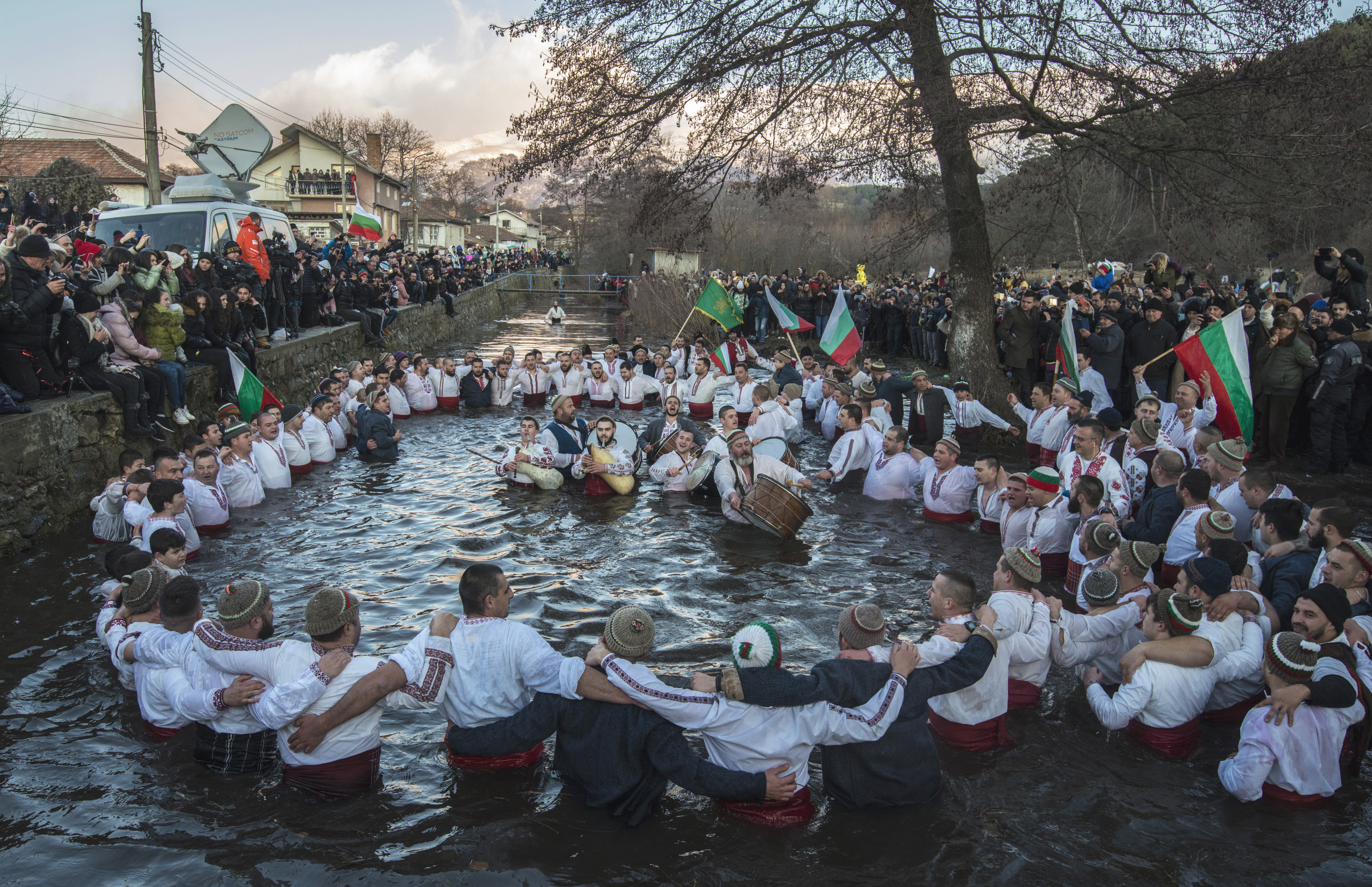 Bulgarians sang, played bagpipes and chain danced in the icy waters of the Tundzha river during a celebration in Kalofer, Bulgaria.