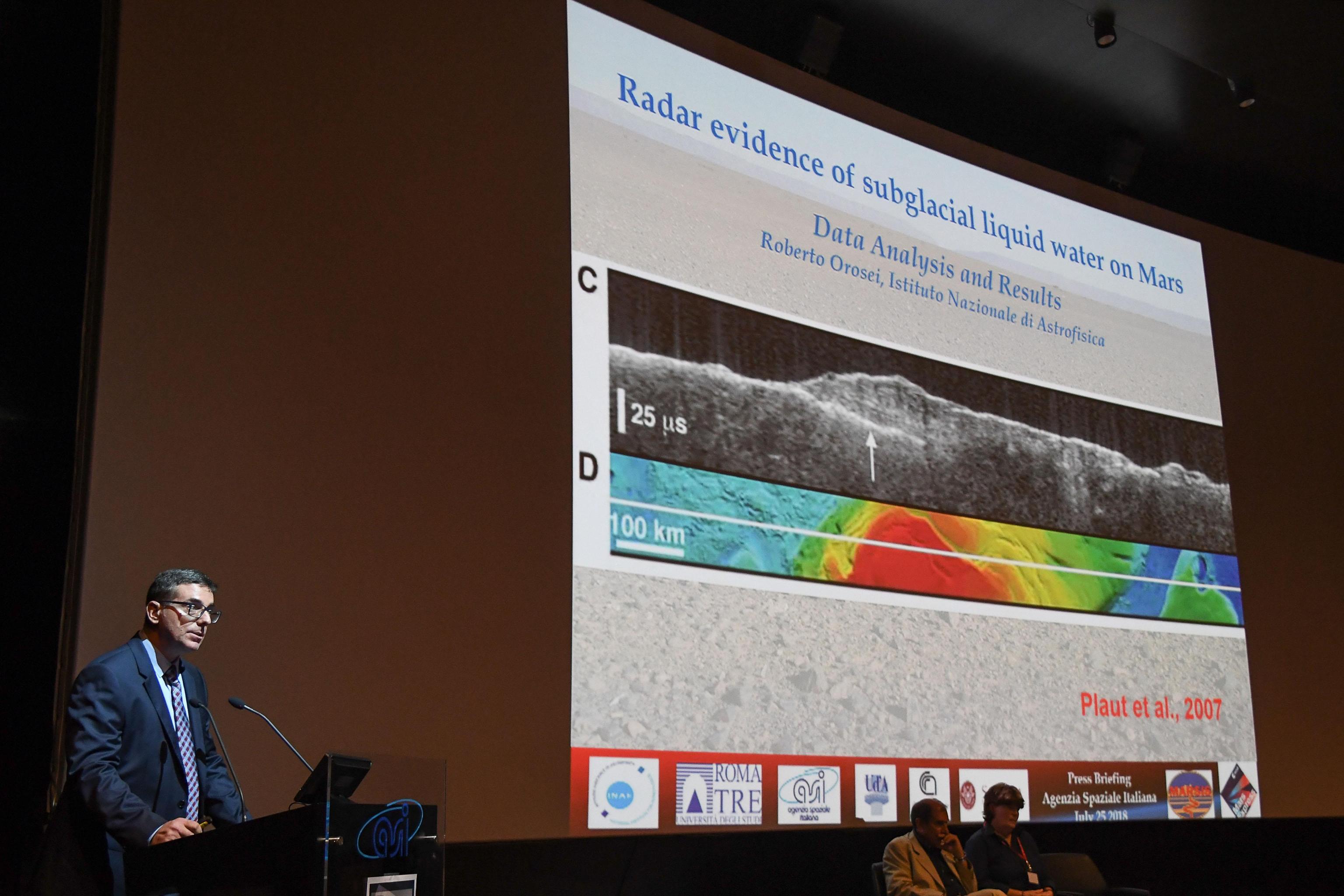 Scientis Roberto Orosei announcing the findings during a news conference on Wednesday