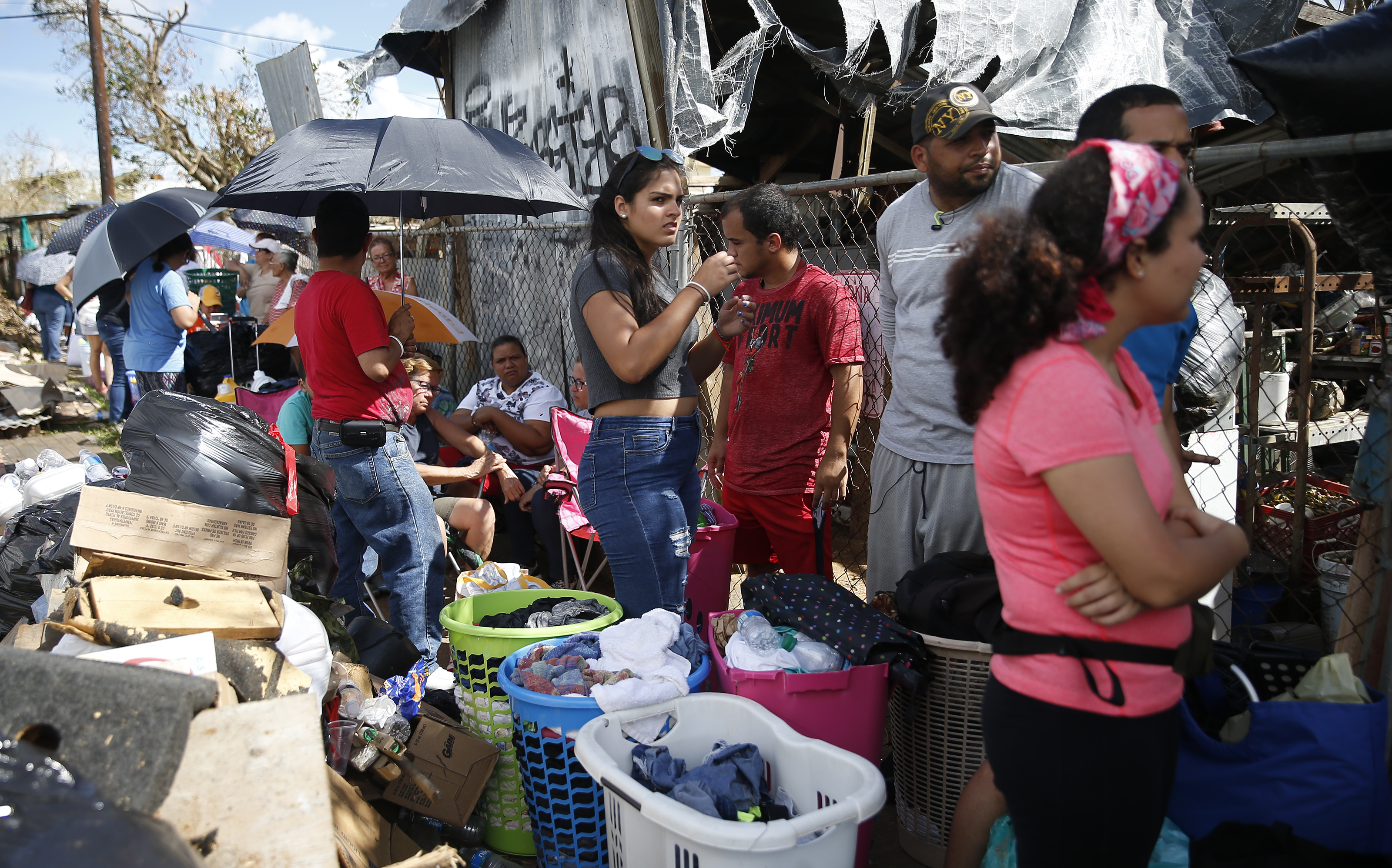 People waited in line for hours to wash their clothes at Pink Coin Laundry in Caguas.