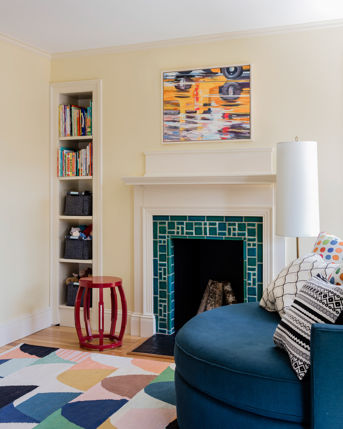 An oversize round chair from Mitchell Gold + Bob Williams is a favorite spot to snuggle and read by the fireplace in one of the children’s bedrooms.