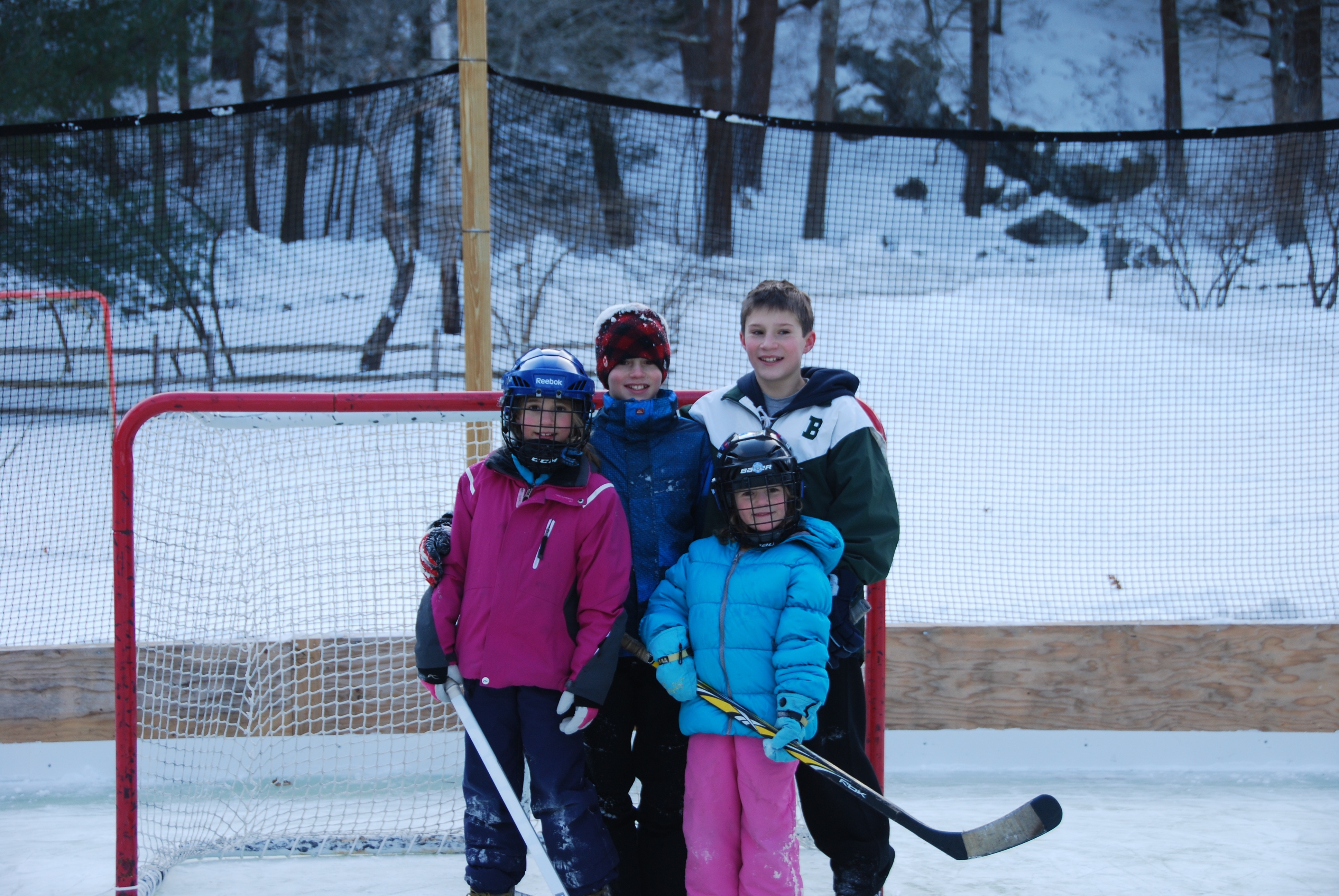 The Gibson kids, from left, Anna 11, George 13, Olivia 8, and Ben 15, on their rink in Essex.