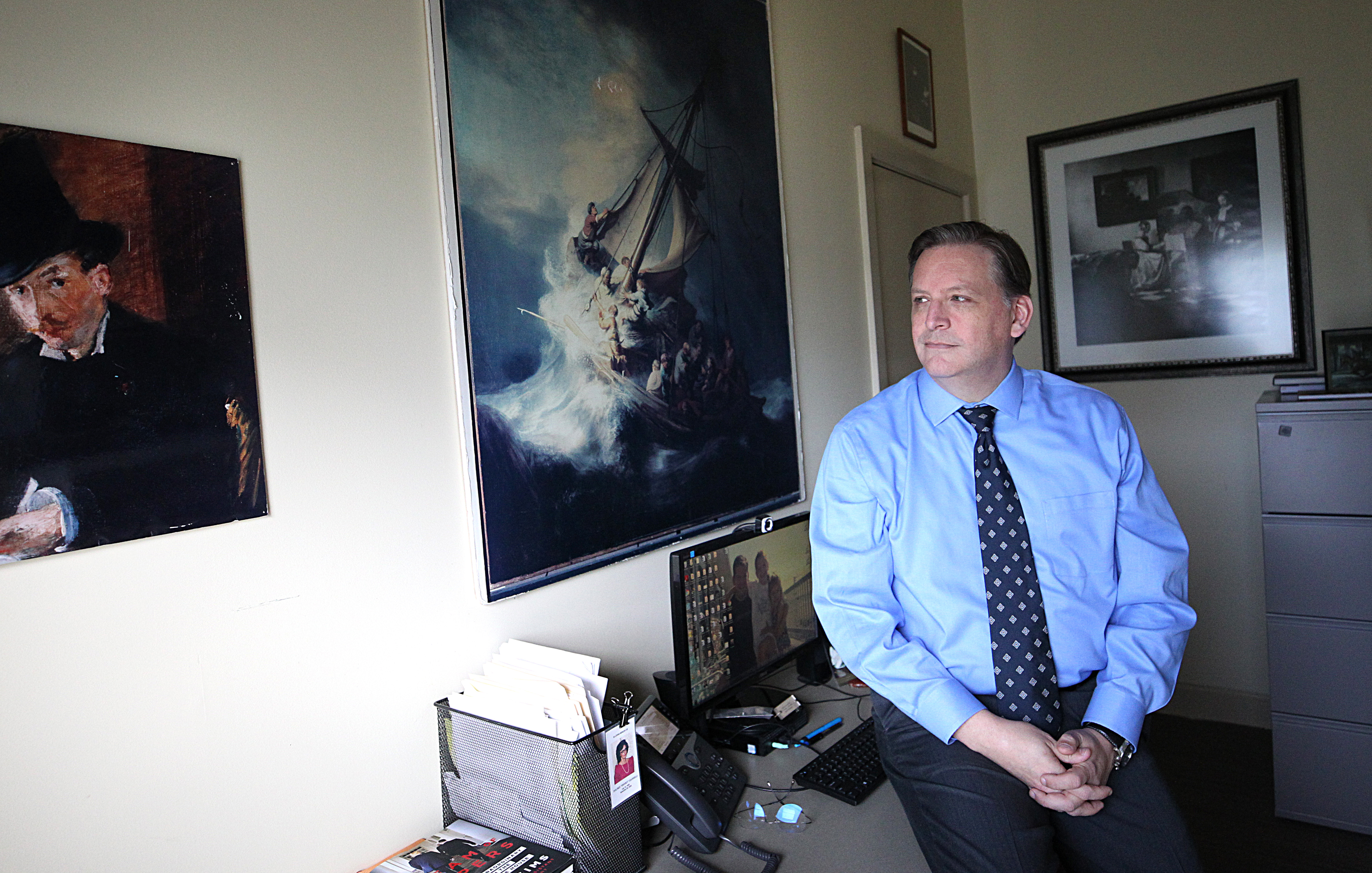 Anthony Amore, in his office at the Isabella Stewart Gardner Museum. To his left is “Chez Tortoni” by Édouard Manet.