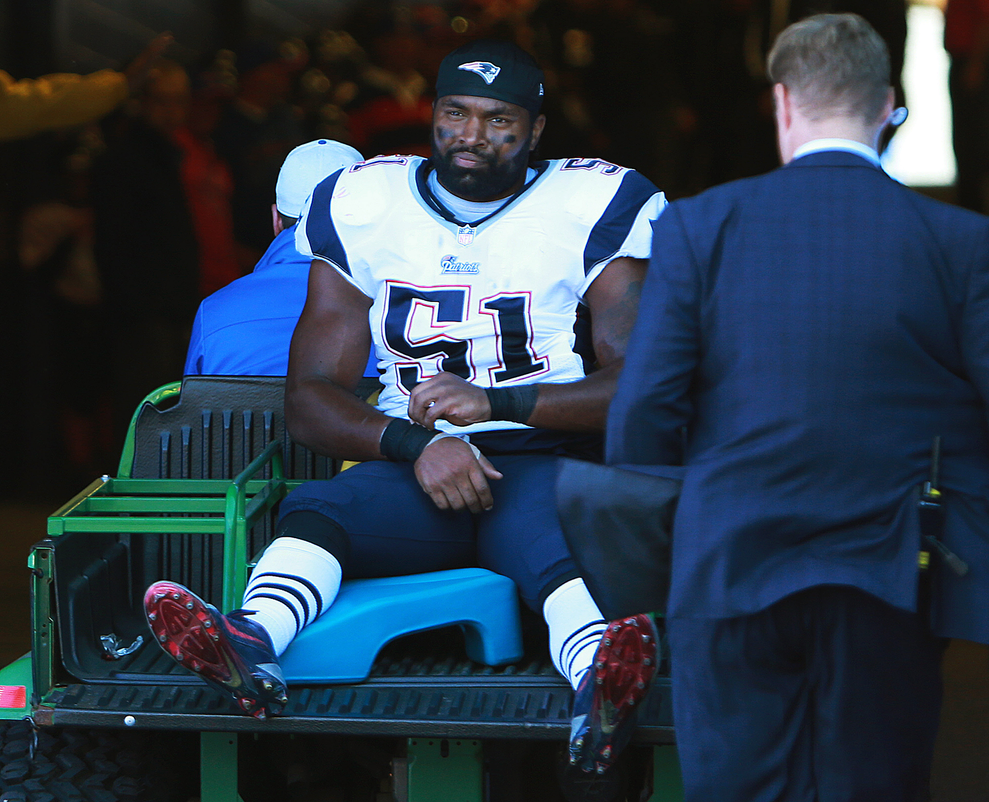 Jerod Mayo was taken to the locker room on a cart Sunday.