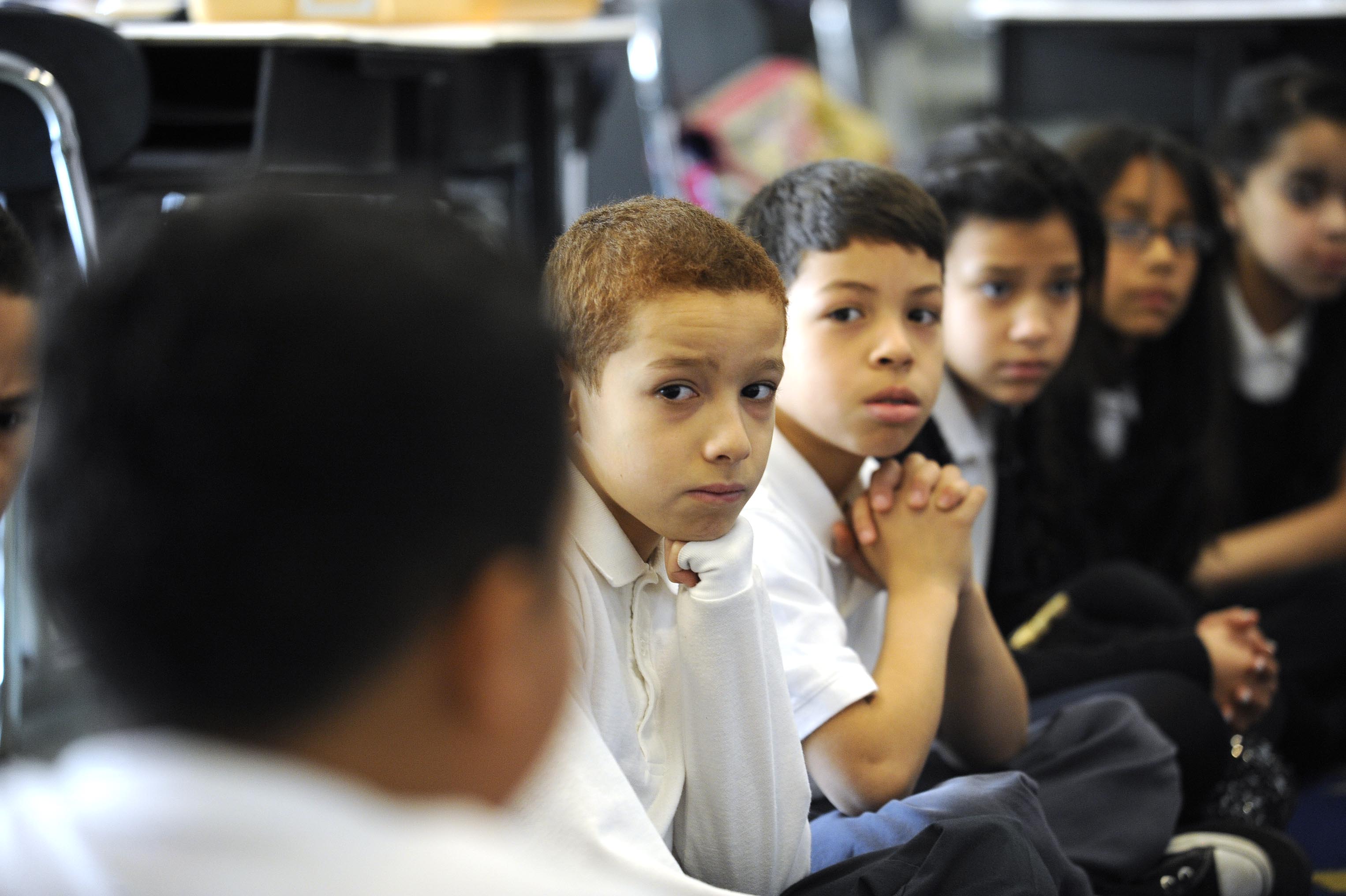 Fourth grade students discuss their ideas for letters they will write to President Obama as part of Mail to the Chief program. At left (back to camera), Jesus Marquez gives his thoughts.