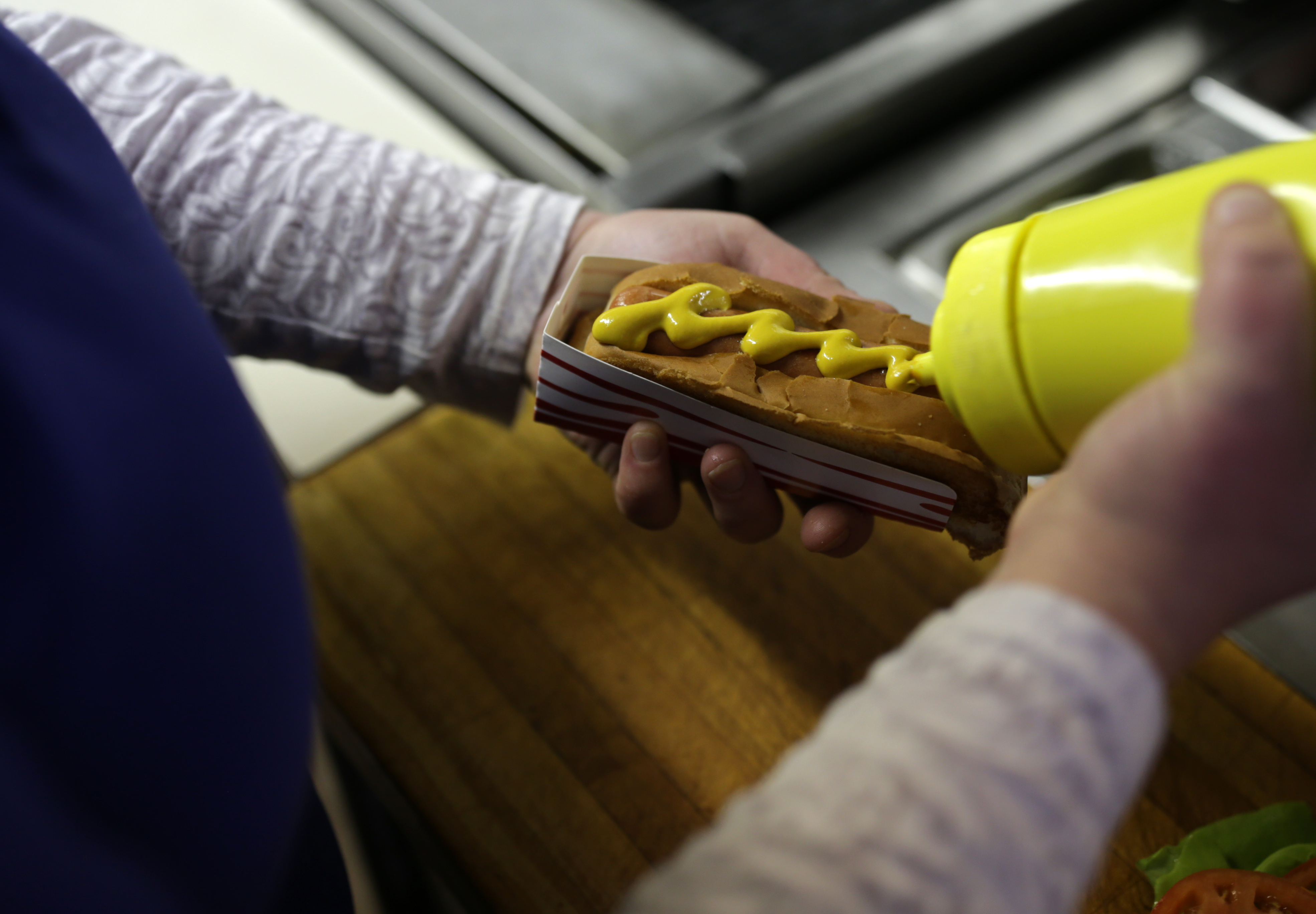 A hot dog is prepared for a customer at Dairy Joy.