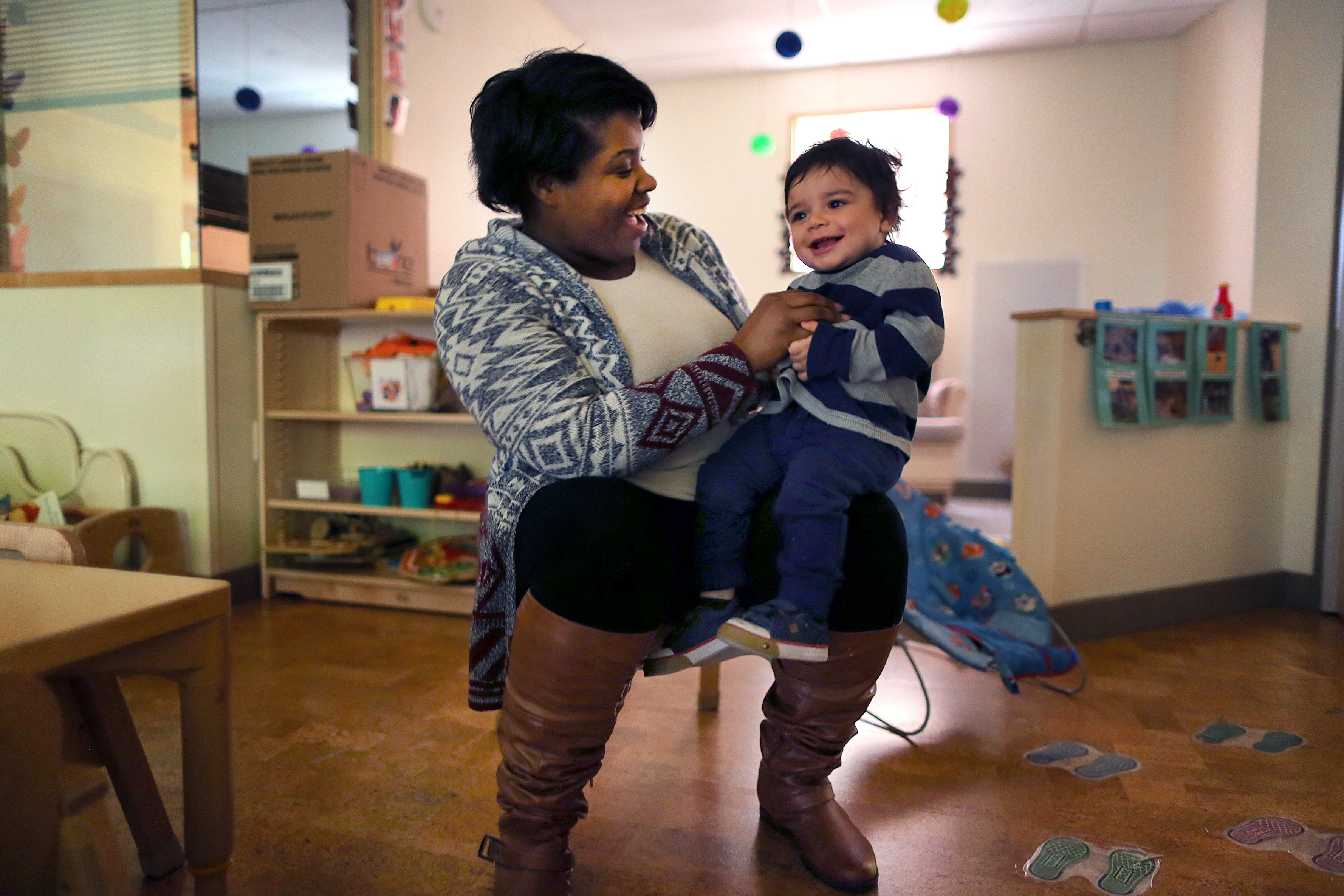 Teacher Akeshia Lewis played with Rowen, 1, in the infant-toddler classroom in Boston’s Nutury Learning Lab.
