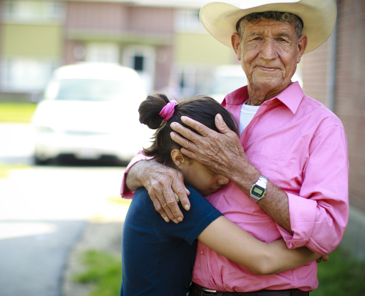 Tranquilino Castañeda, with granddaughter Andrea Ramírez, had always assumed that his youngest son was dead. ‘‘I’mjust glad to have lived long enough to see this day,’’ he said.