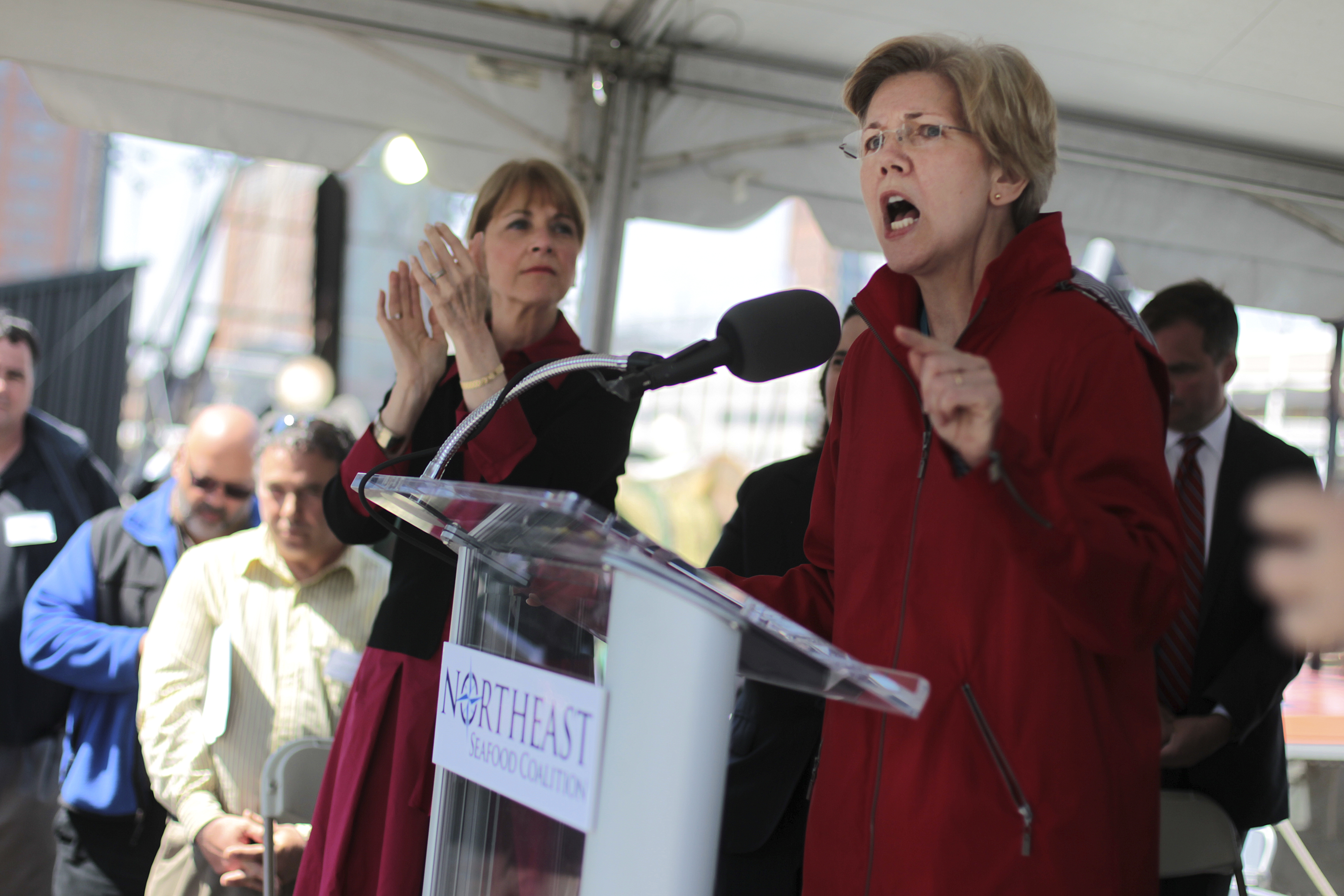 US Senator Elizabeth Warren, with Massachusetts Attorney General Martha Coakley, speaks at a rally of New England fishermen in Boston.
