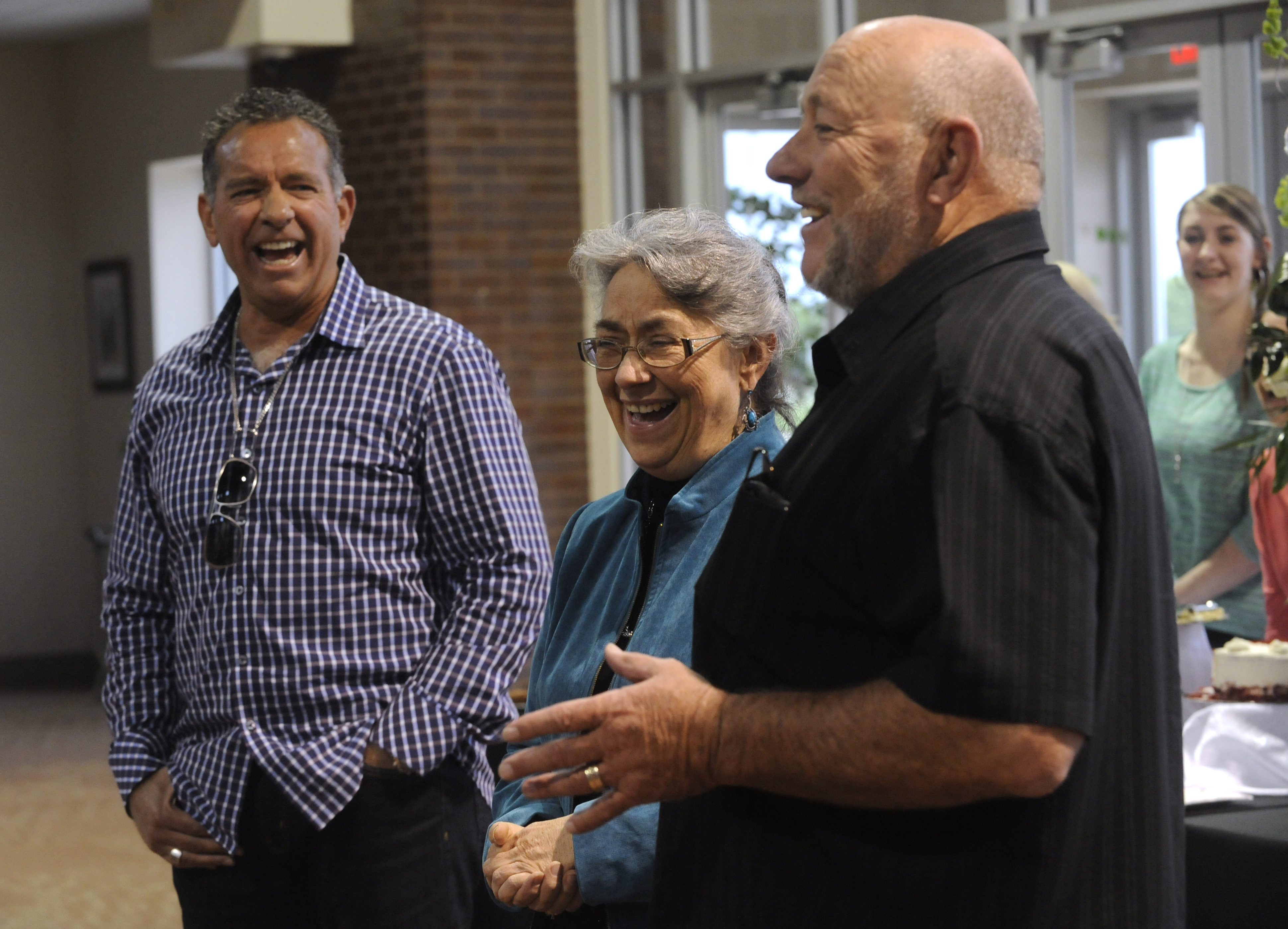 Farris Wilks, right, and his brother Dan laughed with their sister, Beth Maynard, while telling a story about her time working for their company.