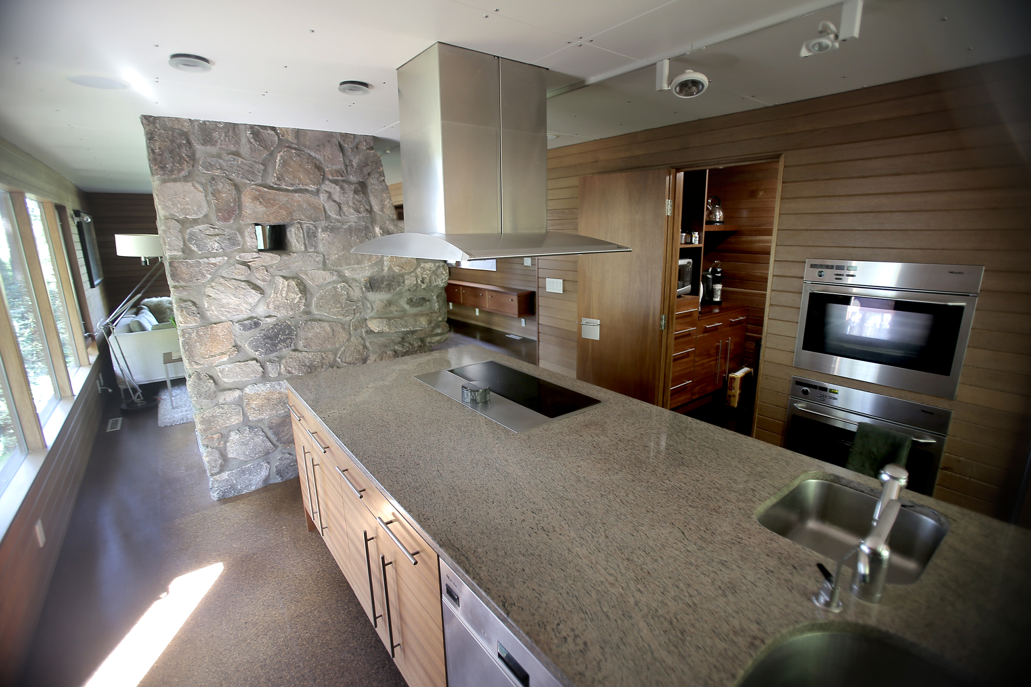 The kitchen now features stainless steel and granite.