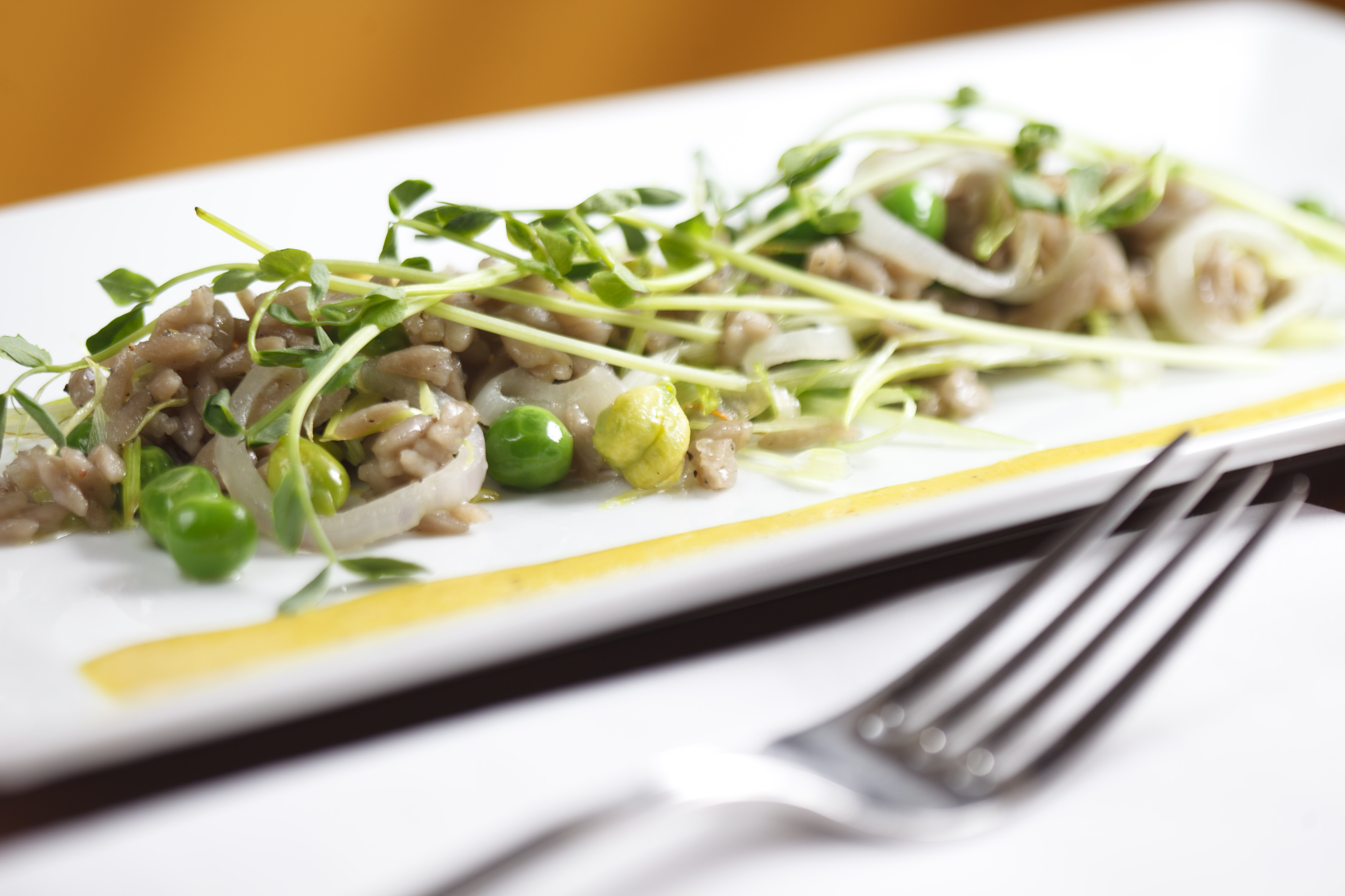 Peas and chickpeas with black olive orzo, spring garlic, pea shoots.