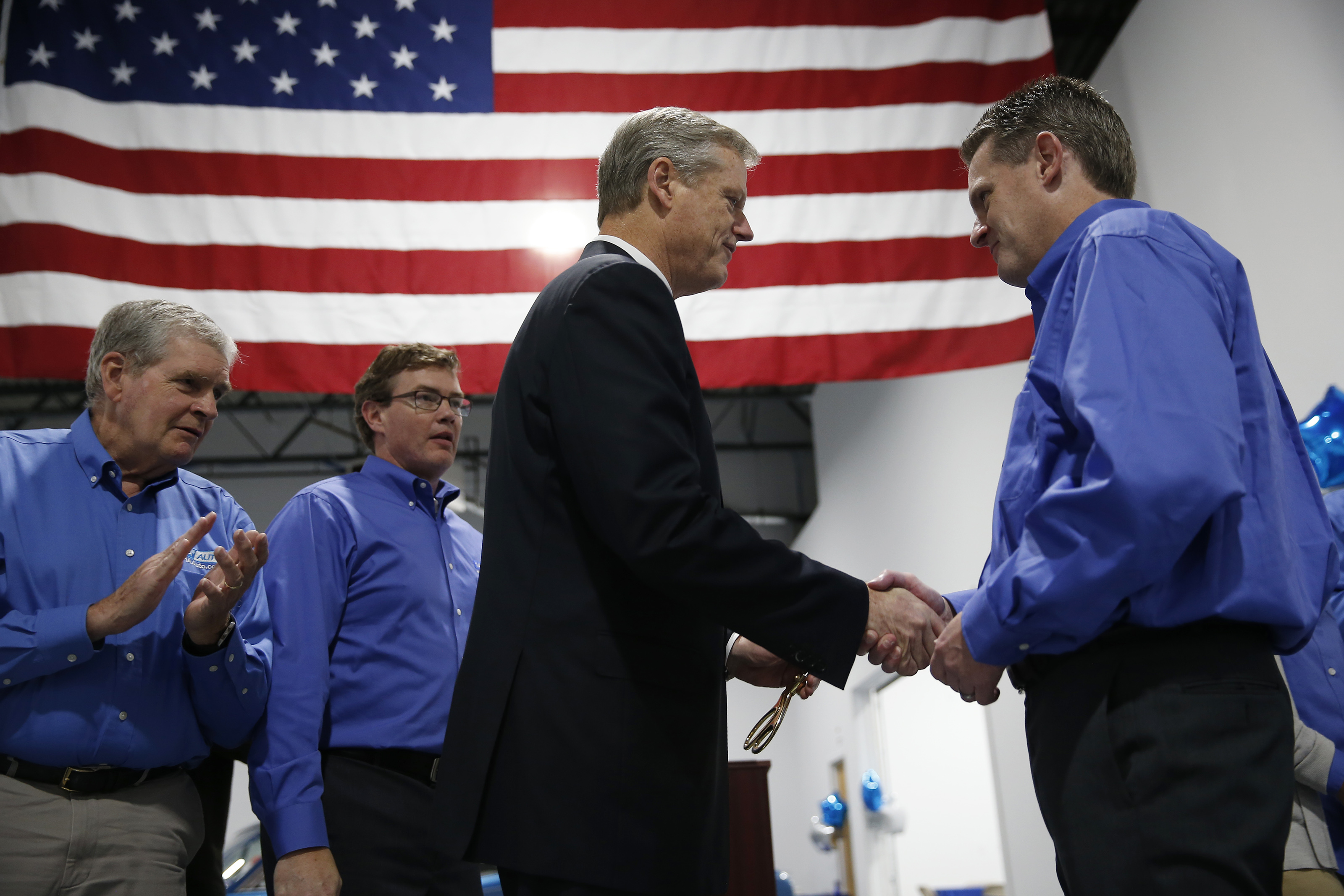 Baker shook hands with Republican congressional candidate Rick Green in Pepperell on Thursday.