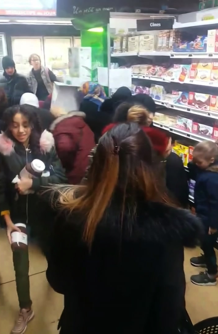In this image taken from a video, customers rush to carry away pots of Nutella in a Toulon, France, supermarket.