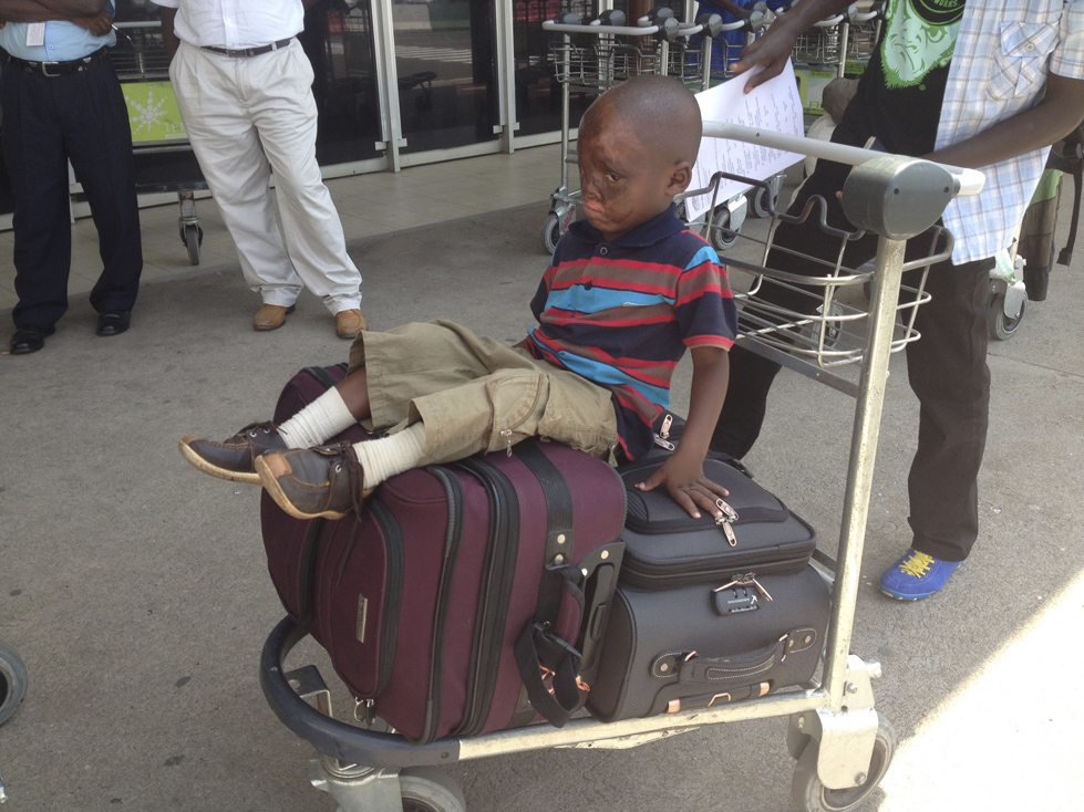 Leo cried after parting with his parents at an airport in Burundi in June 2014.