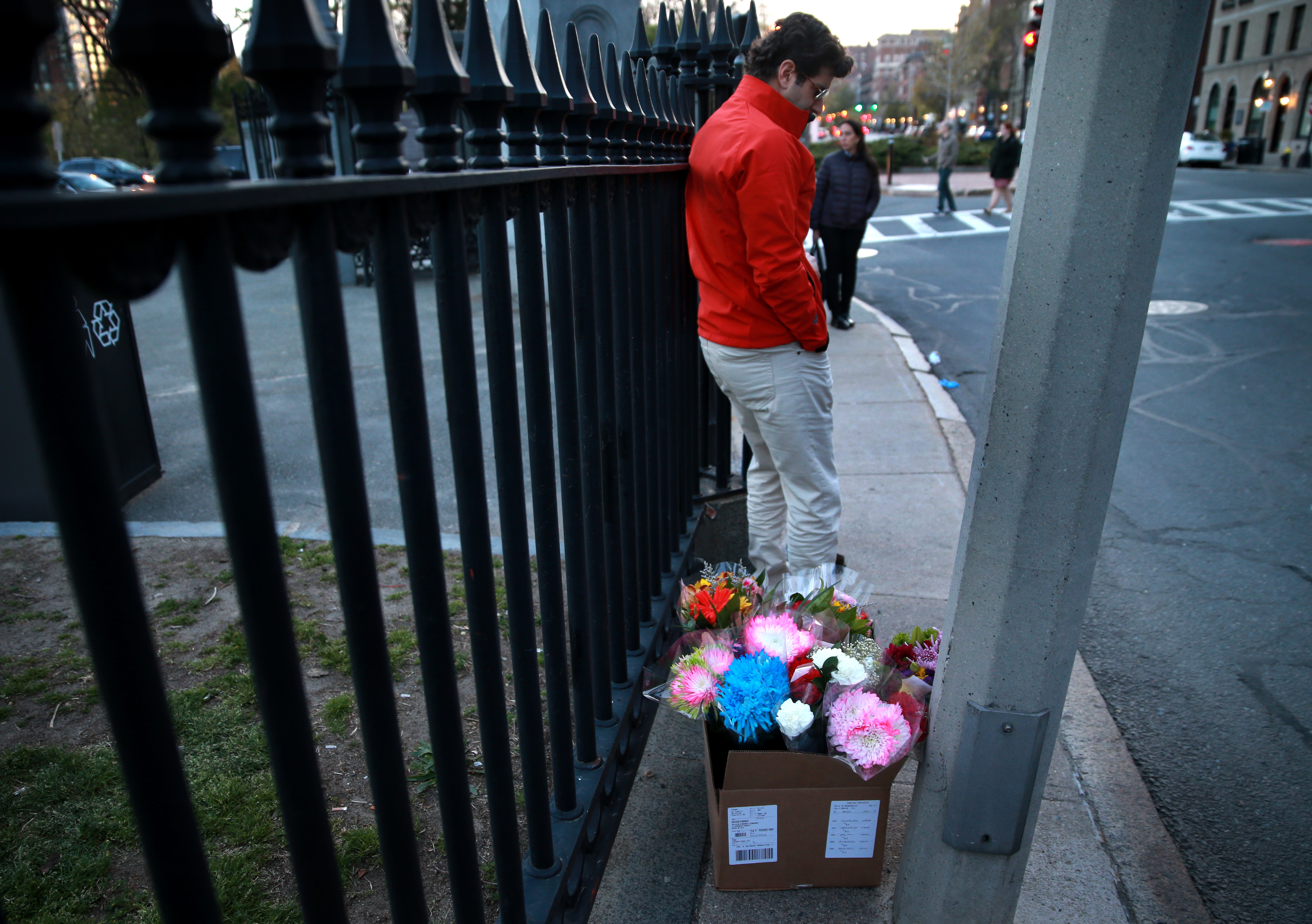 Ethan Crain, a friend of the victim, brought flowers to the crash scene.