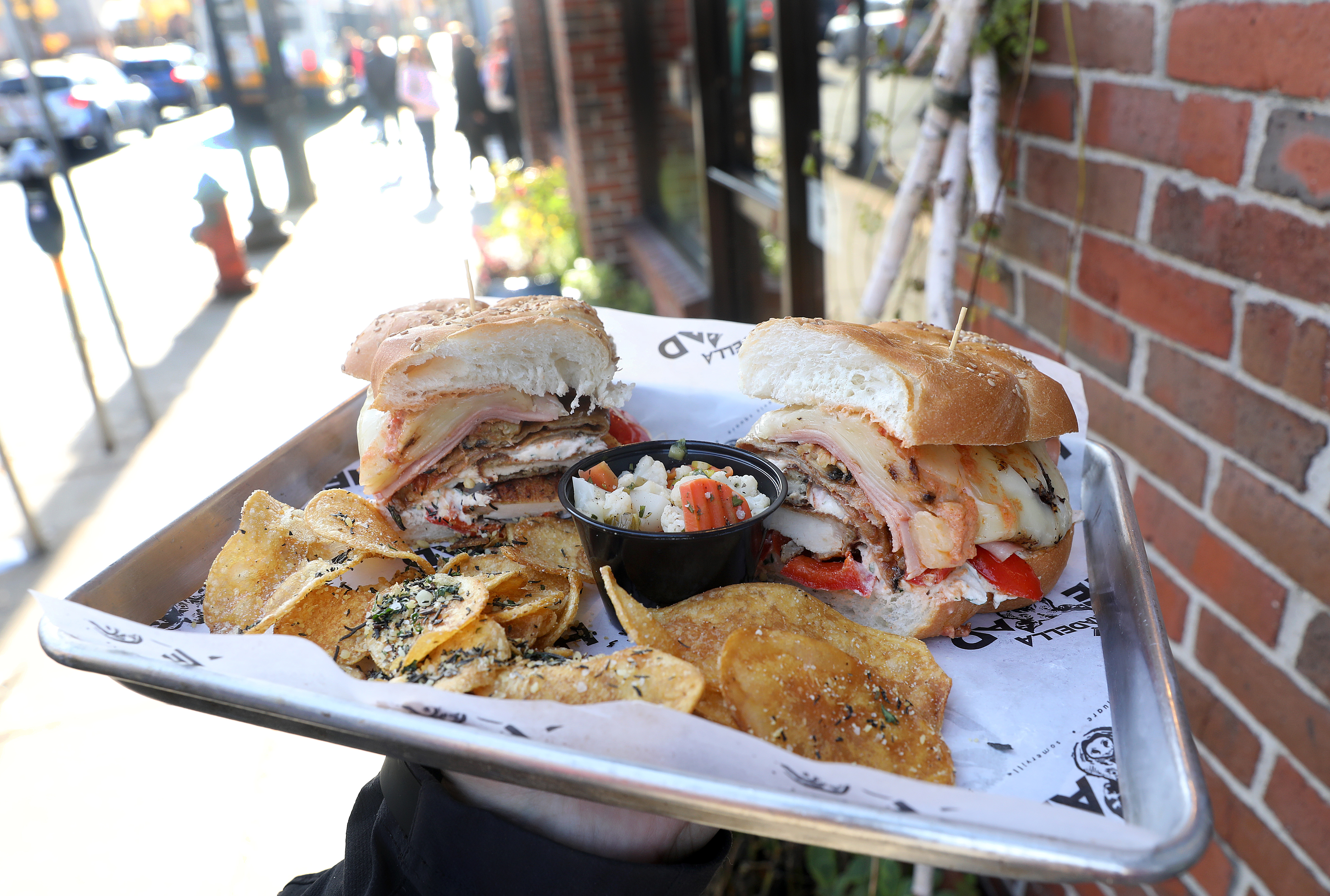 The “Mortadella Head” sandwich with potato chips and giadiniera.