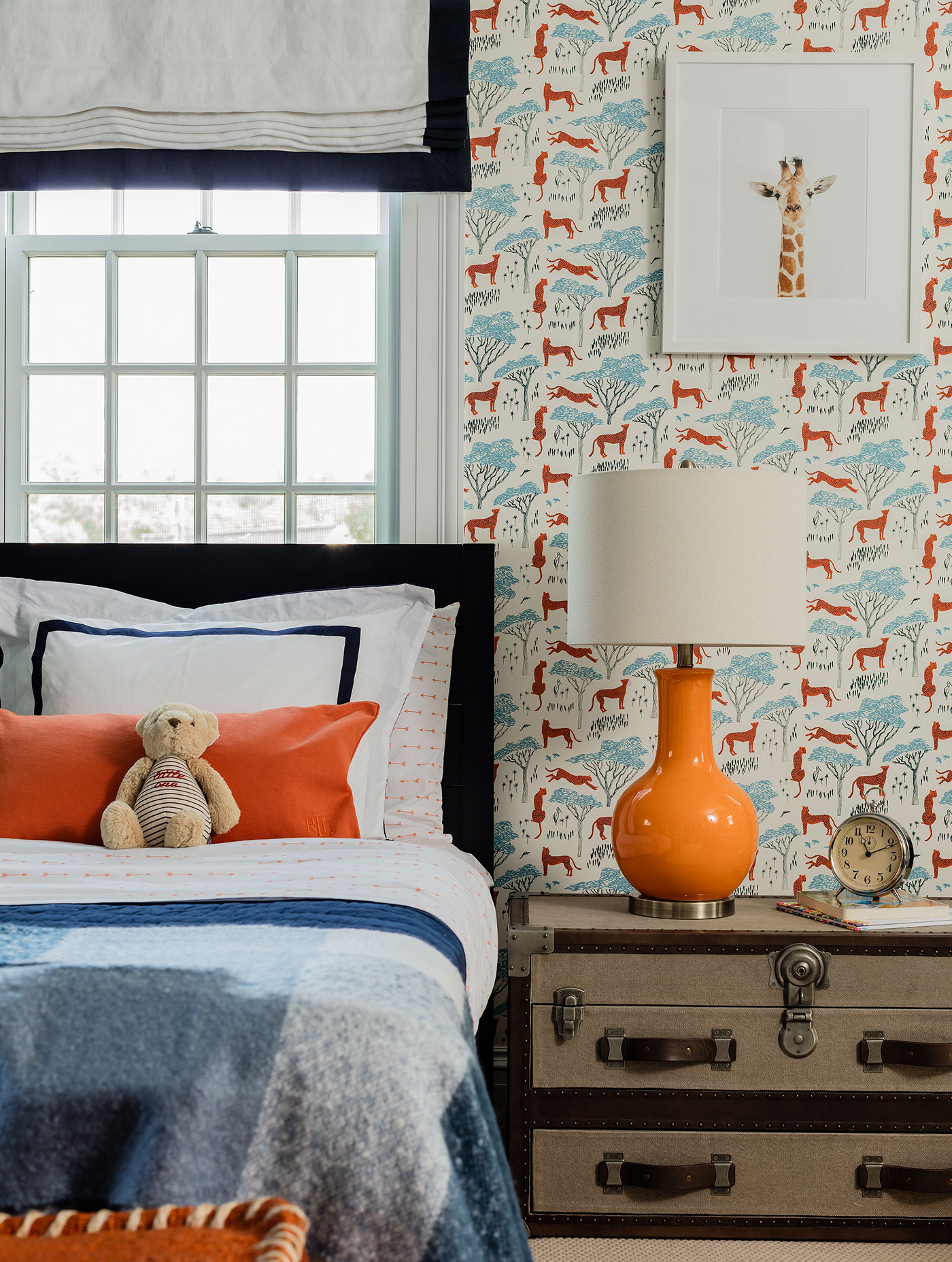 Between the beds from Room & Board in the son’s bedroom is a photo of a baby giraffe from The Animal Print Shop by Sharon Montrose.