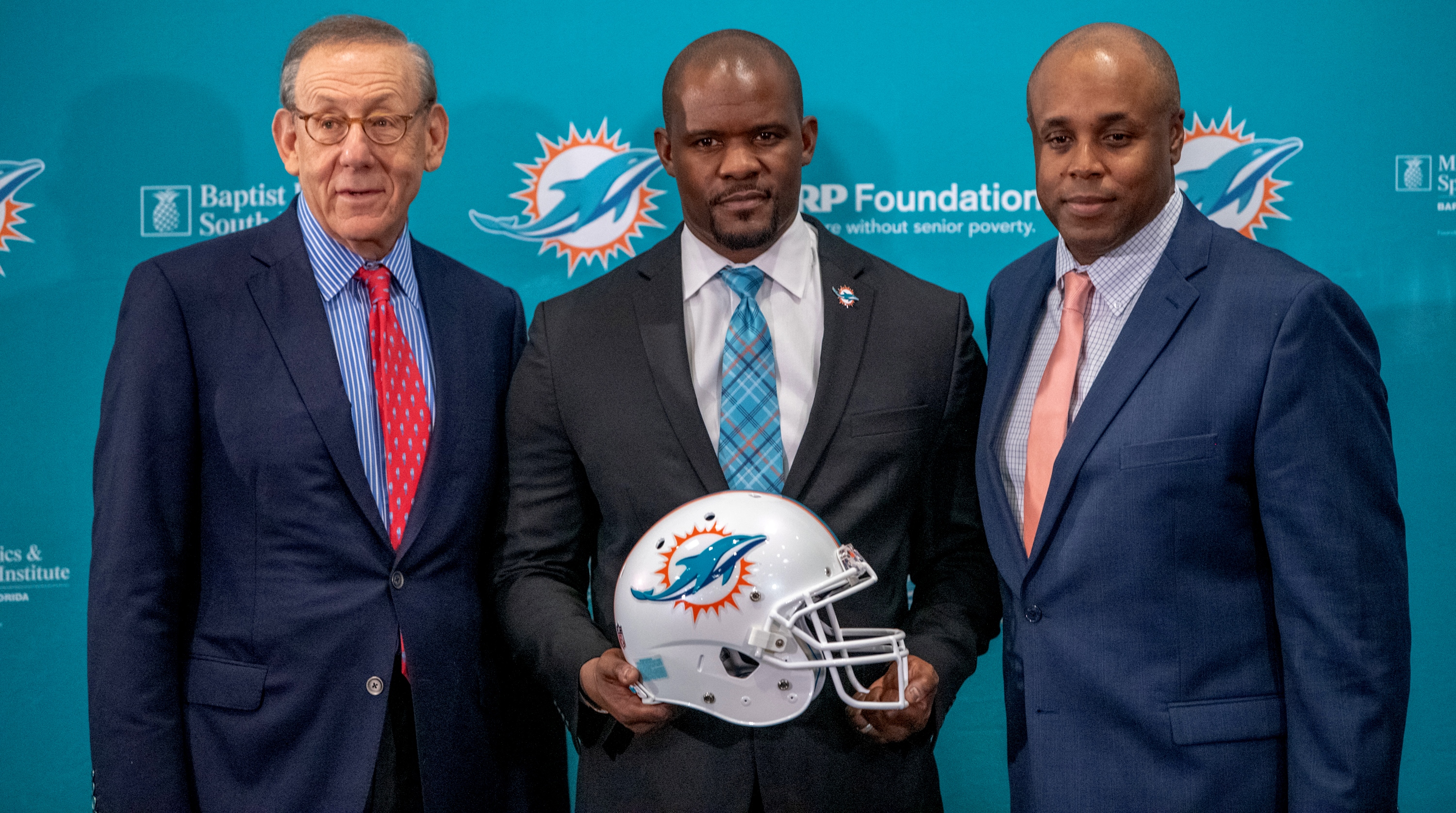 Not even 24 hours after helping the Patriots win the Super Bowl, Brian Flores (center) jumped to their AFC East rivals, the Miami Dolphins, where he’ll be working with owner Stephen Ross (left) and general manager Chris Grier.