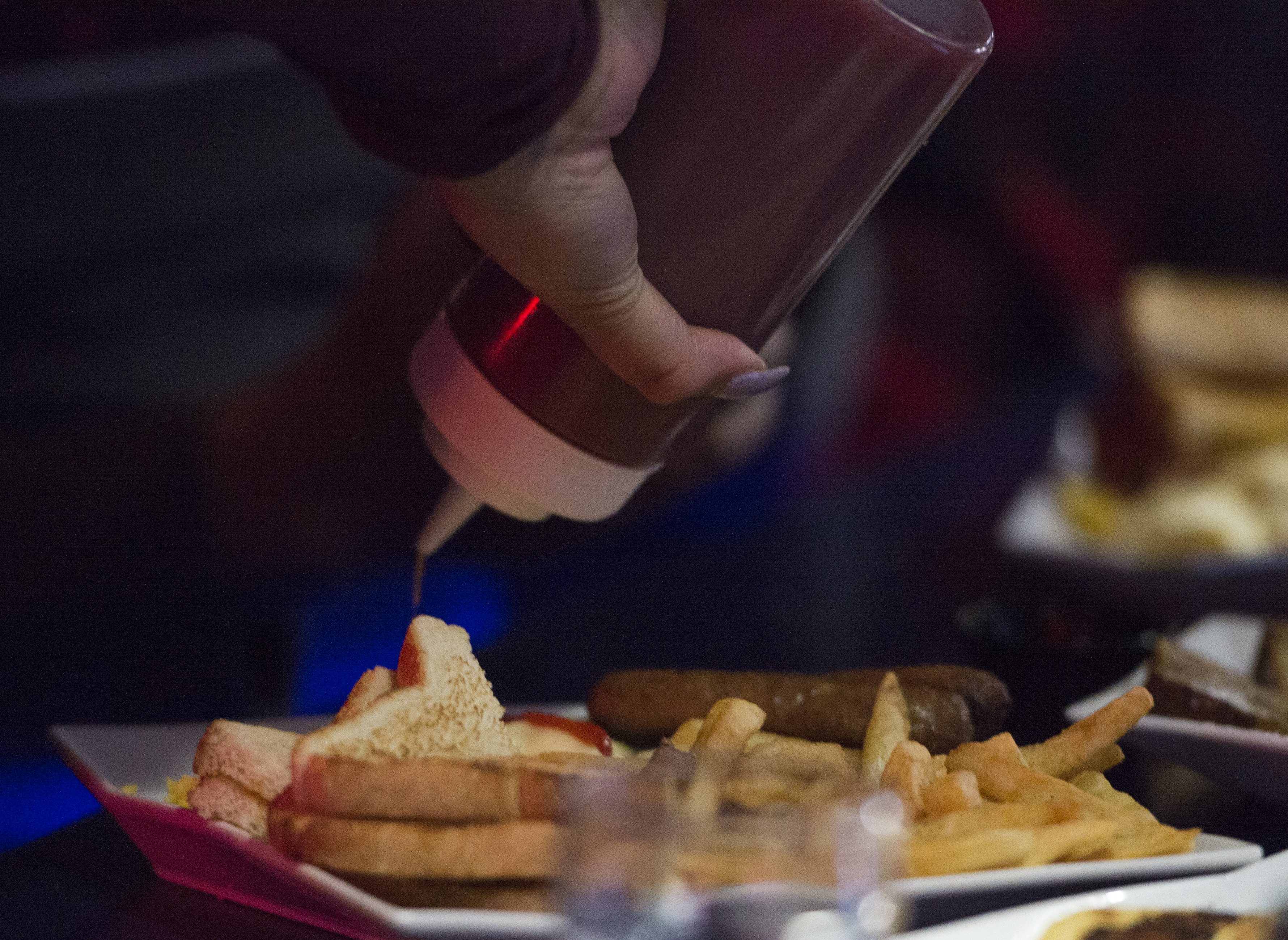 Kianna Barbosa liberally applied ketchup to her eggs at South Street Diner.