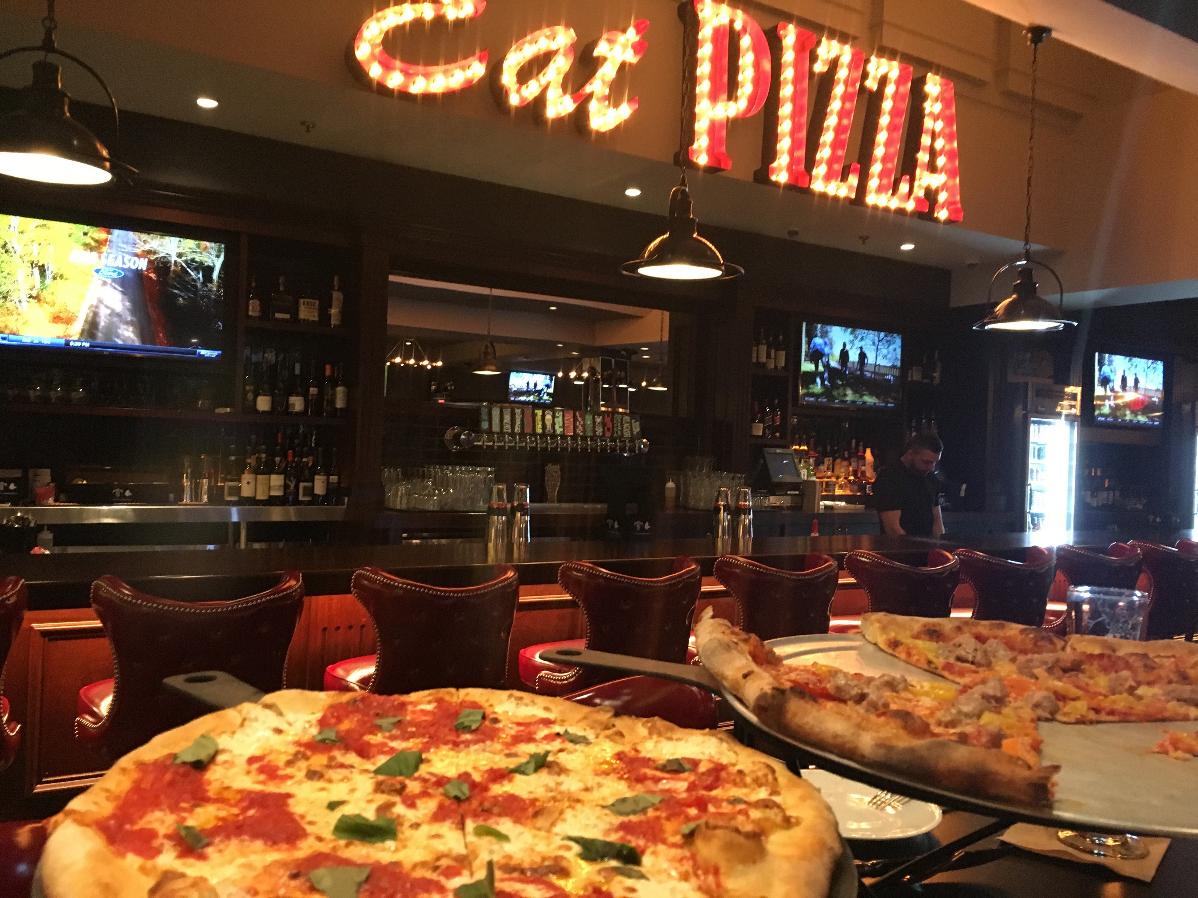 The wood-fired Margherita (left) and the coal-fired Piccante at Jack’s Coal Fired Pizza.