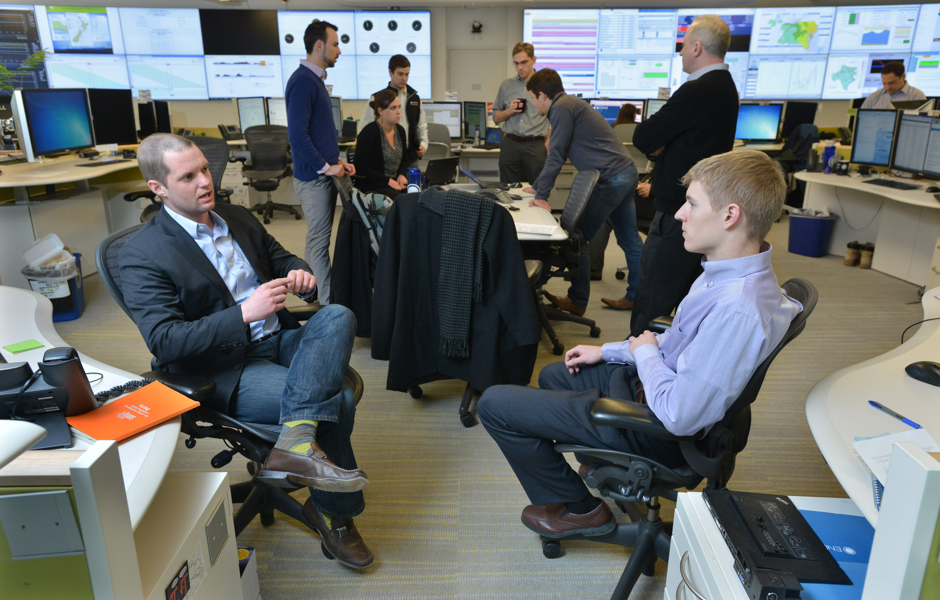 Nate Brown (left), EnerNOC’s lead generation manager, talked with lead generation specialist Ryan Hagan in the company’s Network Operations Center.