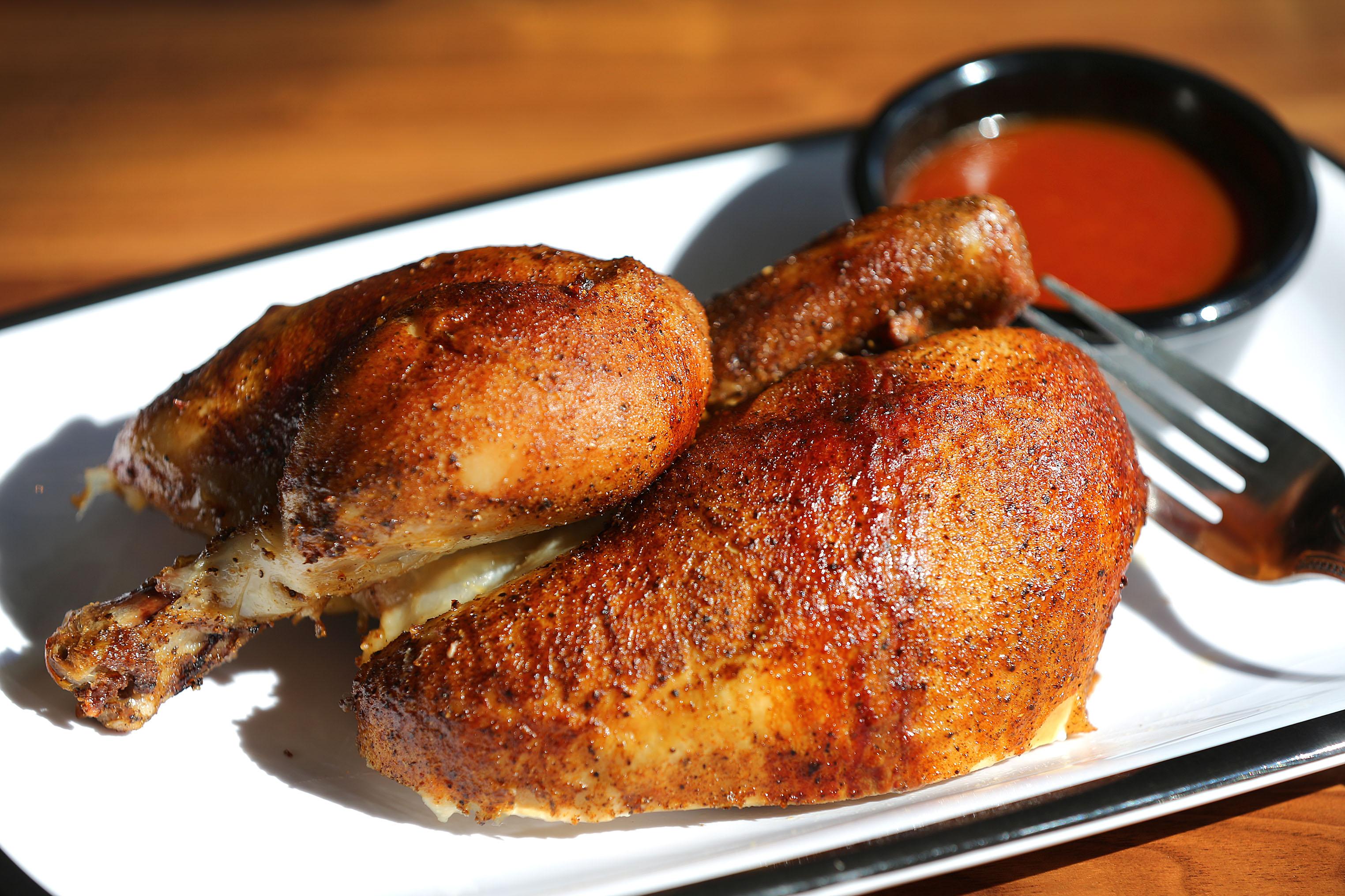 The half chicken with juniper-pepper barbecue sauce, a Shy Bird staple.