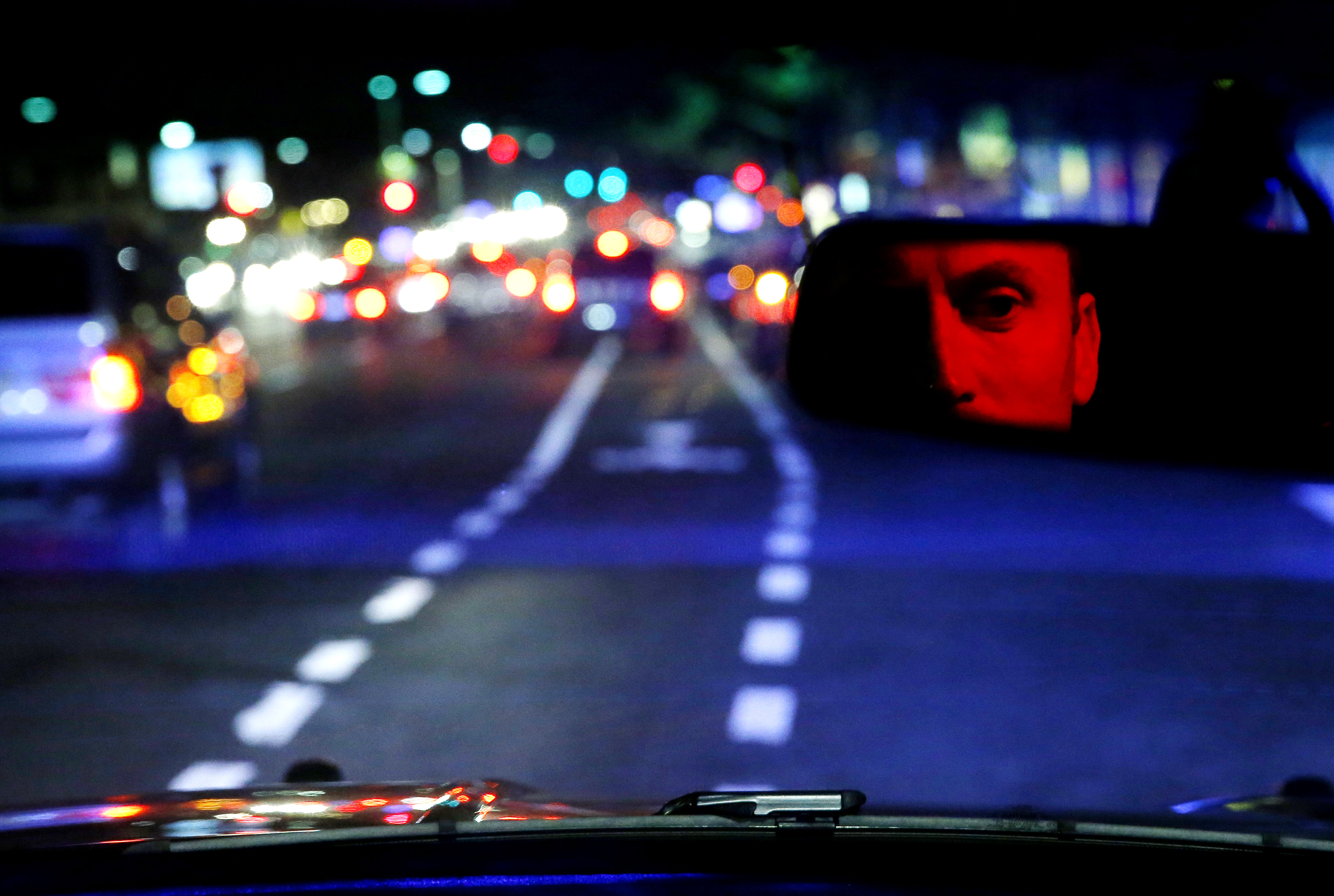 Driscoll, as reflected in his rearview mirror.