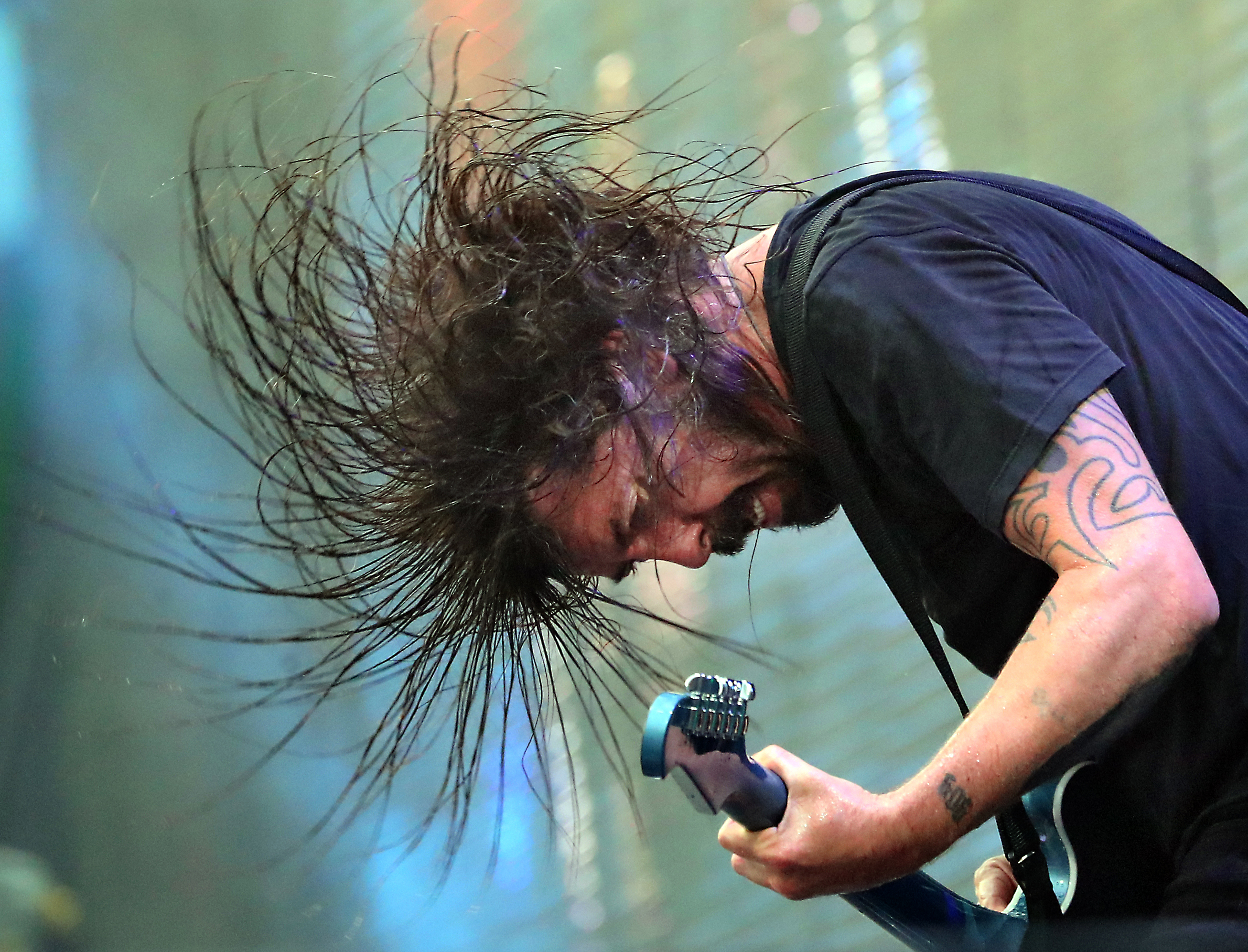 Dave Grohl, lead singer with the Foo Fighters, in concert with his band at Fenway Park.