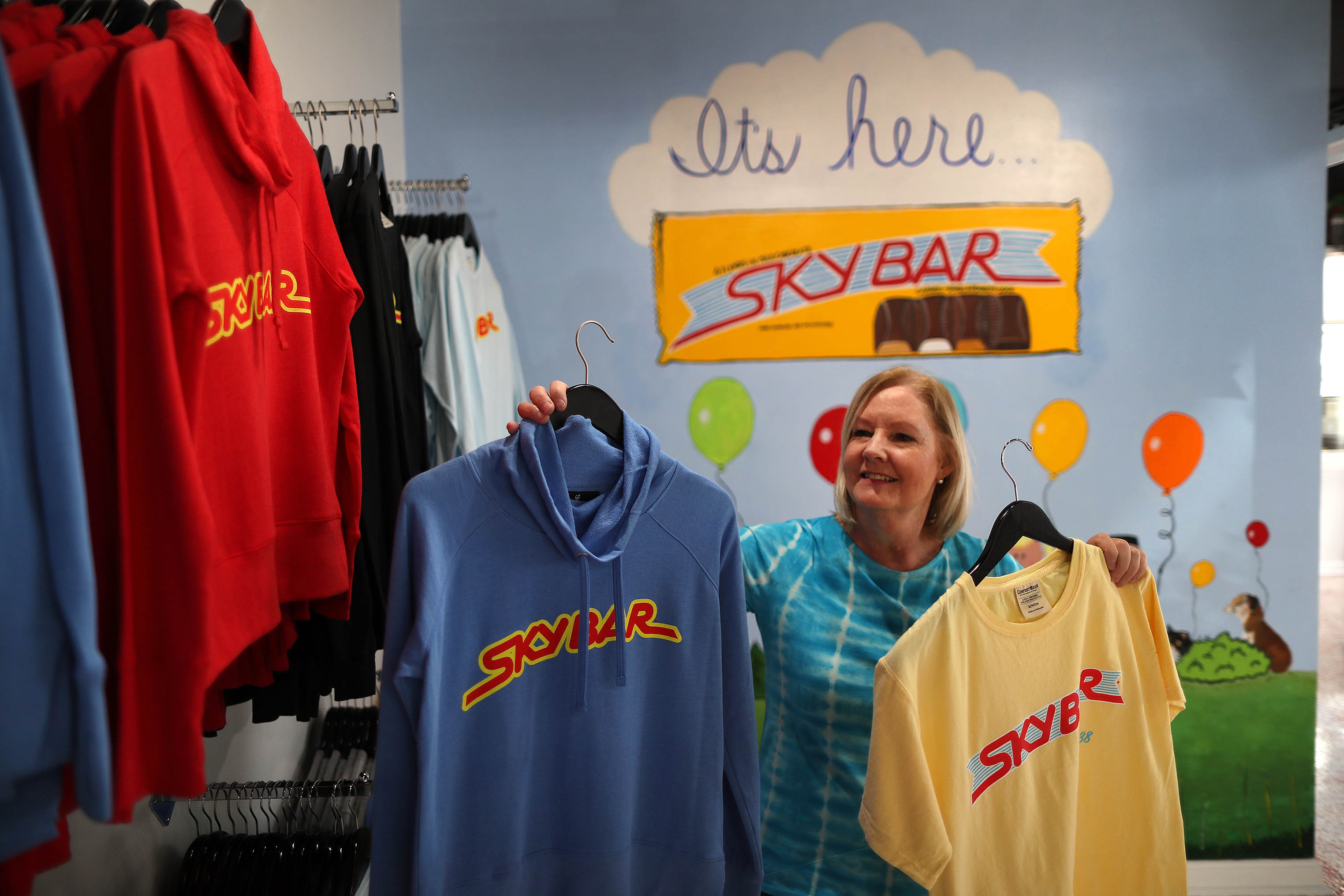 Louise Mawhinney sells Sky Bar shirts in her store.