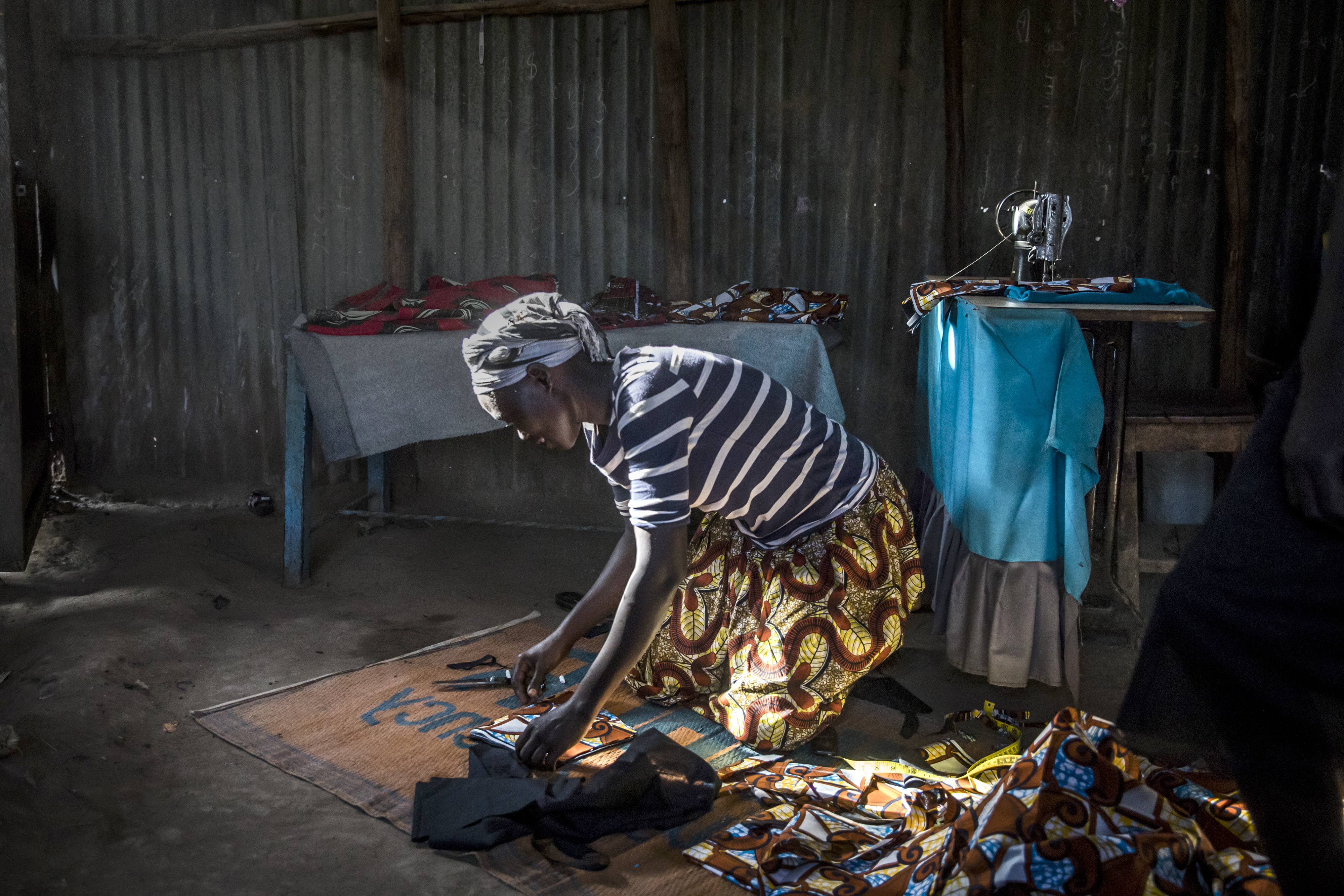 Achayo Loum, a student of Southern New Hampshire University’s online degree program for refugees, worked on a dress in the UNHCR refugee camp in Kakuma.