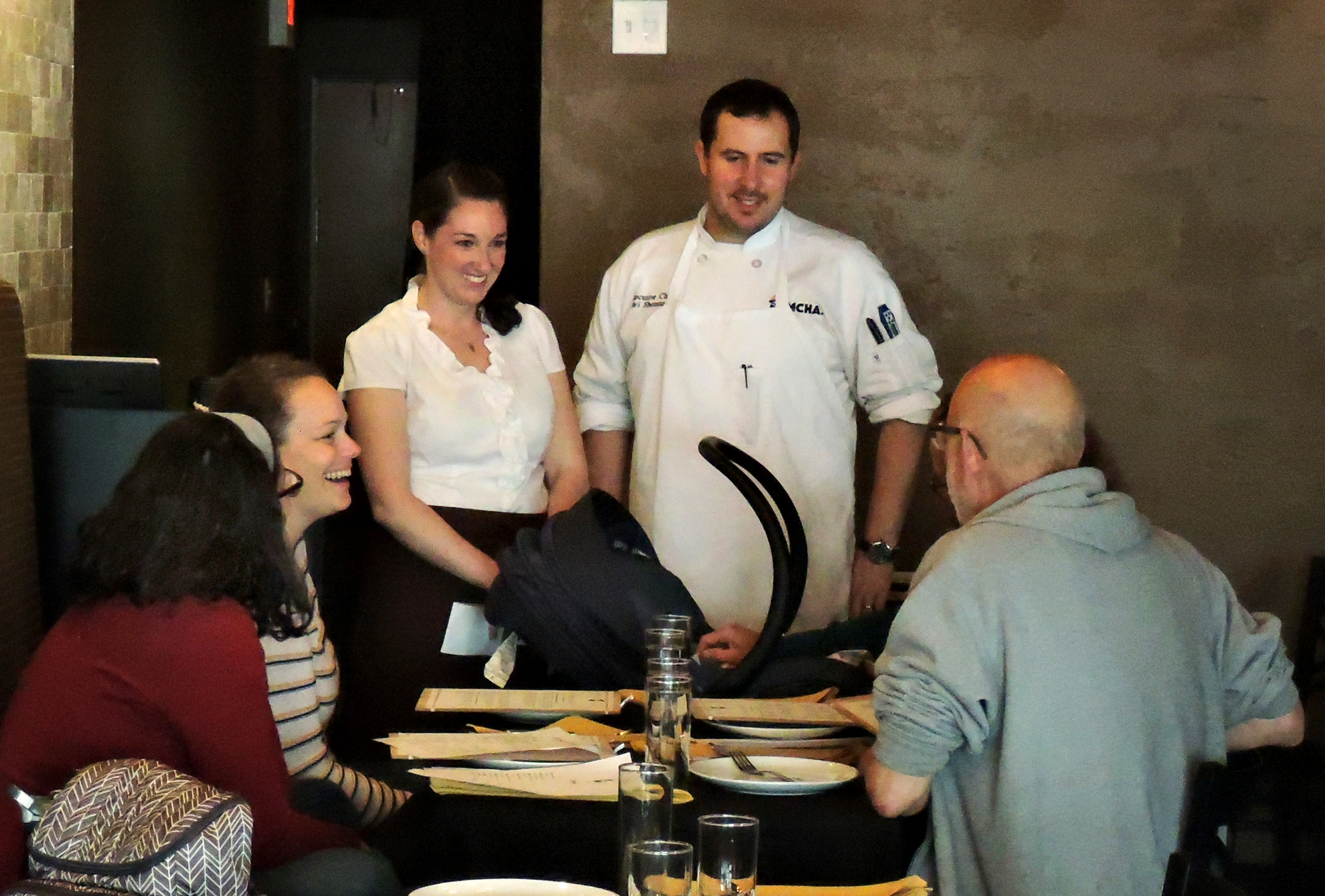 Avi Shemtov and his wife, Adrien, talk to patrons.