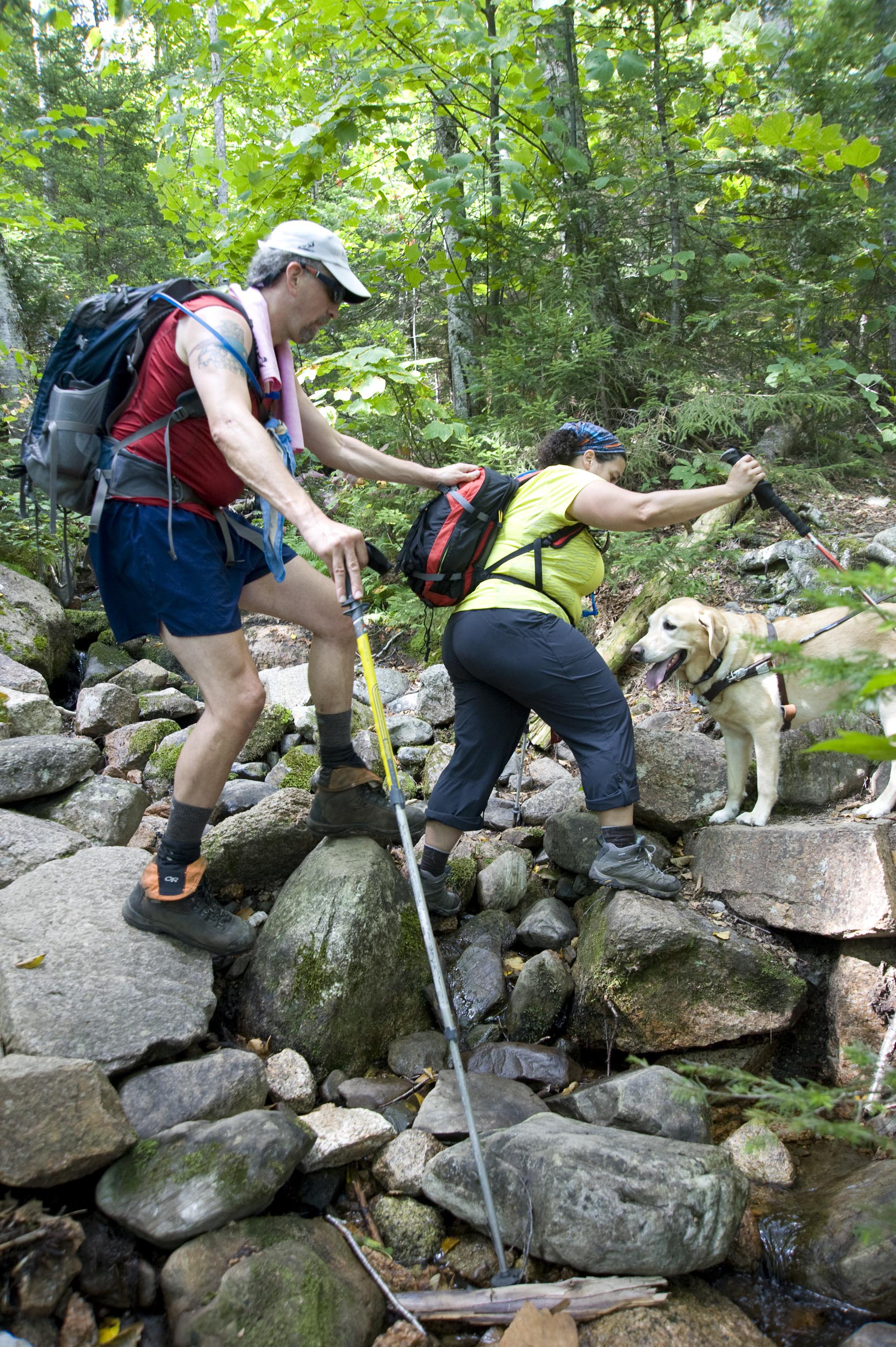 Randy Pierce held on to the pack of his wife, Tracy Pierce, as he made his way along the Willey Range Trail.
